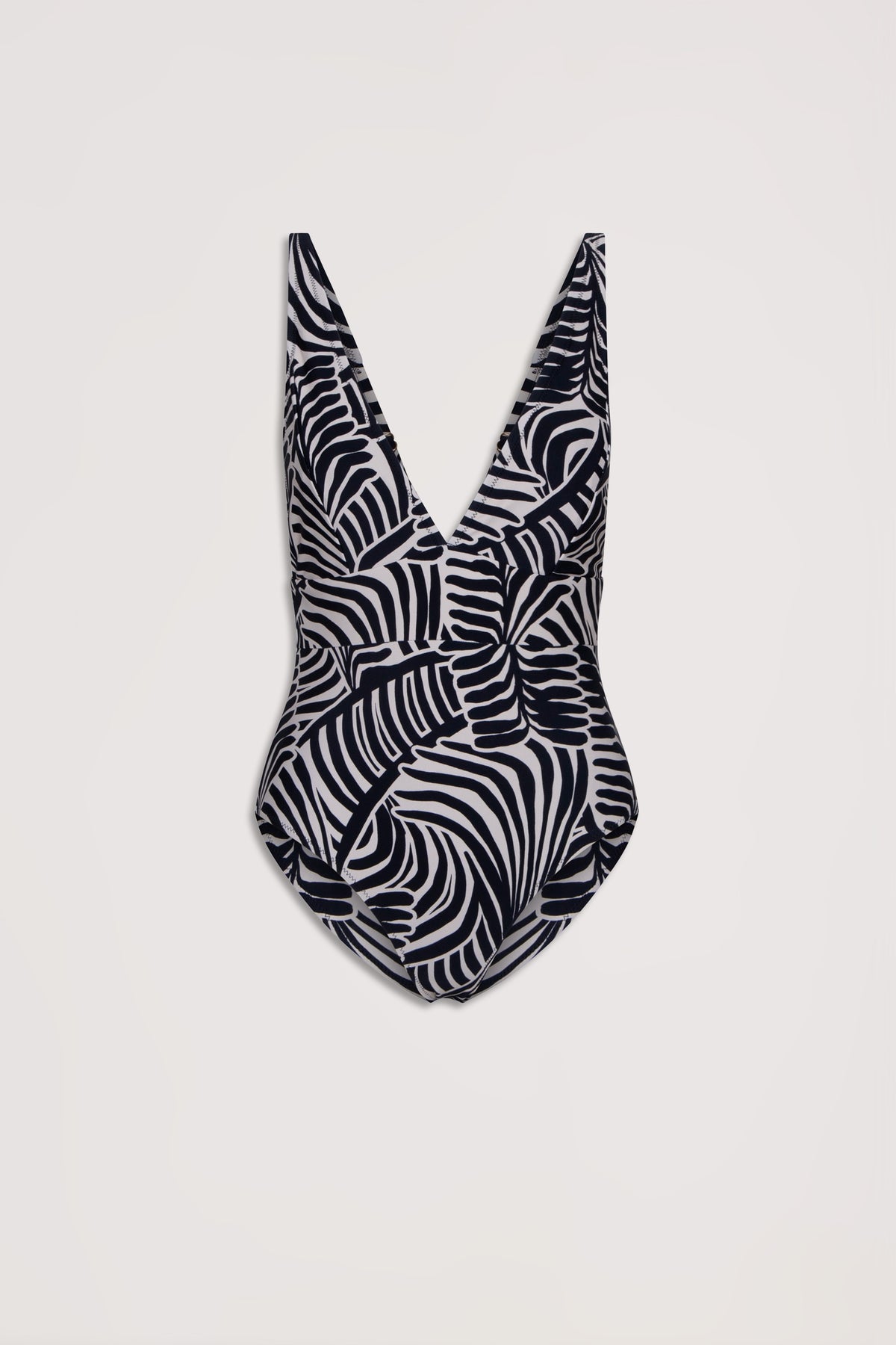 One-piece swimsuit with deep V neckline featuring a bold black and white tropical leaf matte print