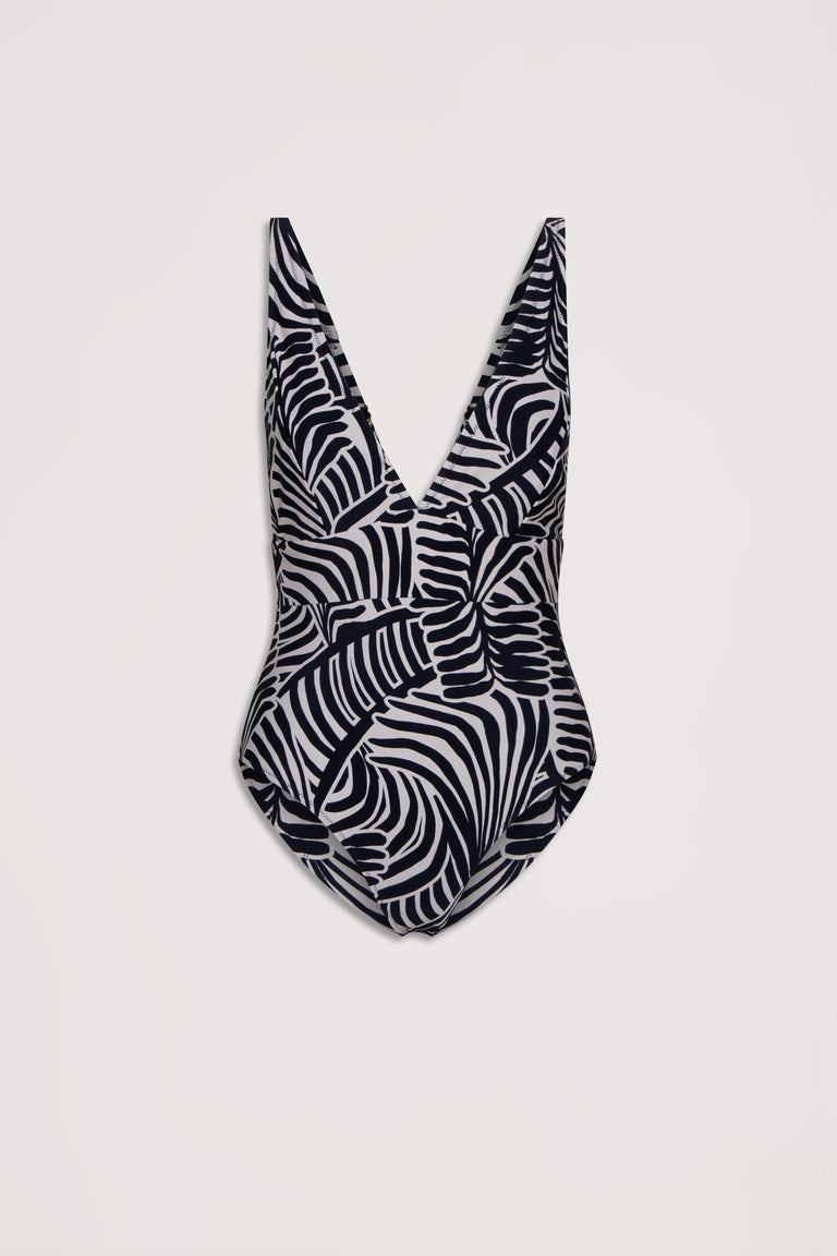 One-piece swimsuit with deep V neckline featuring a bold black and white tropical leaf matte print