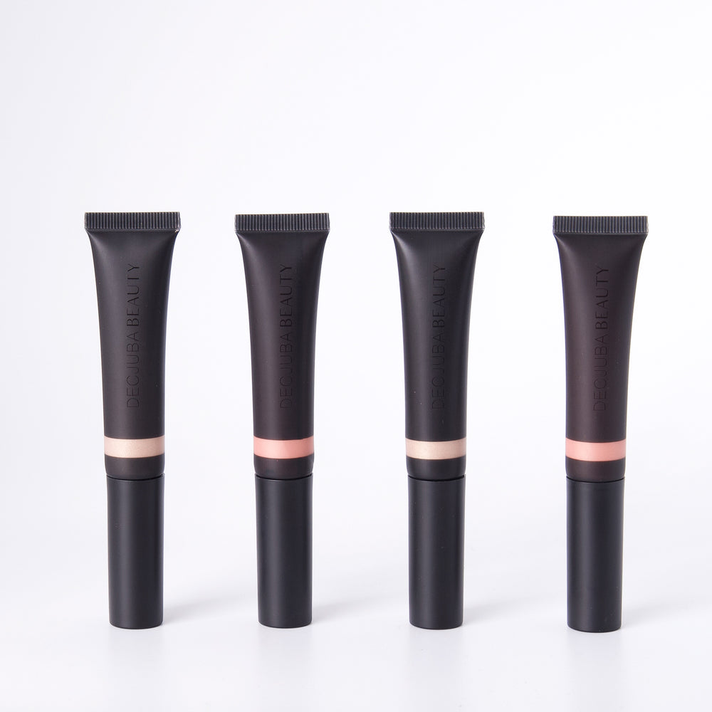 Four black highlighting wand tubes in two shades of face illuminator