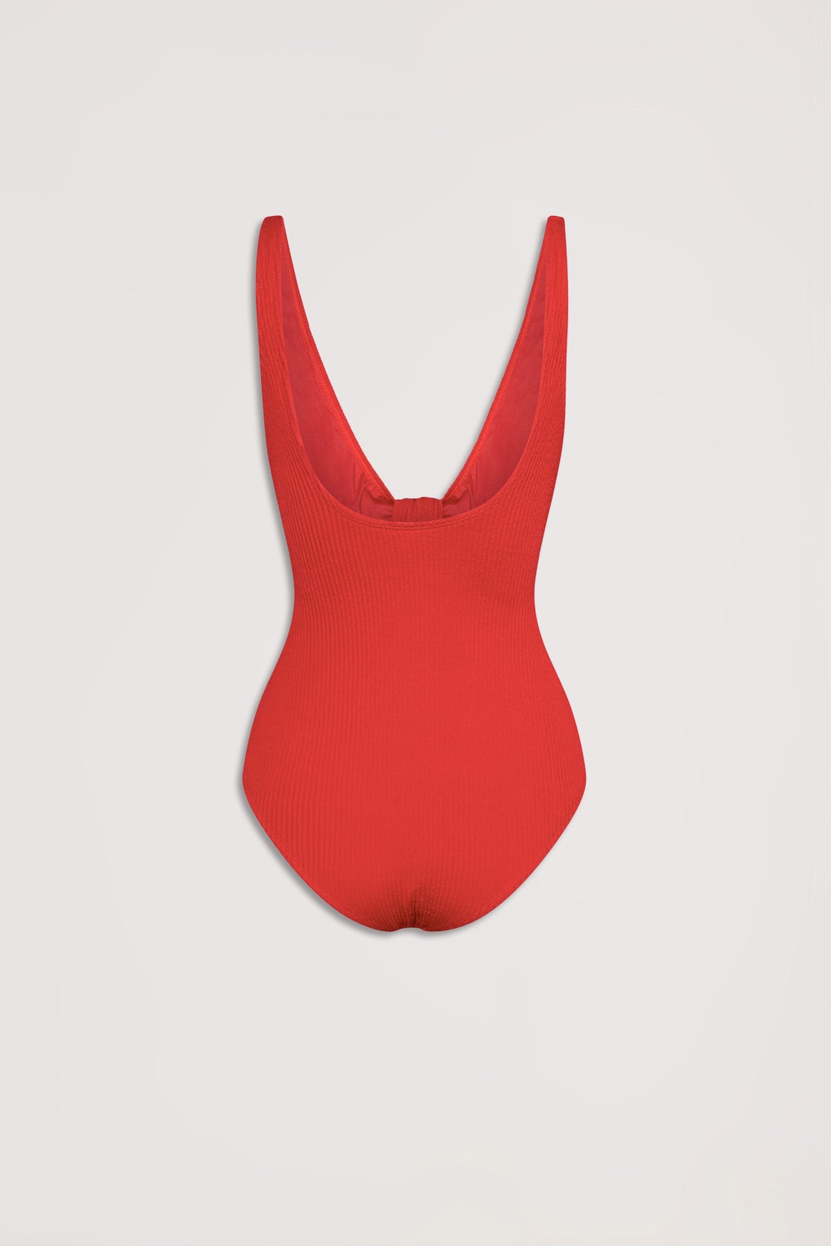 Crimson red crinkle-textured one-piece with deep scoop back, designed for effortless style and comfort.