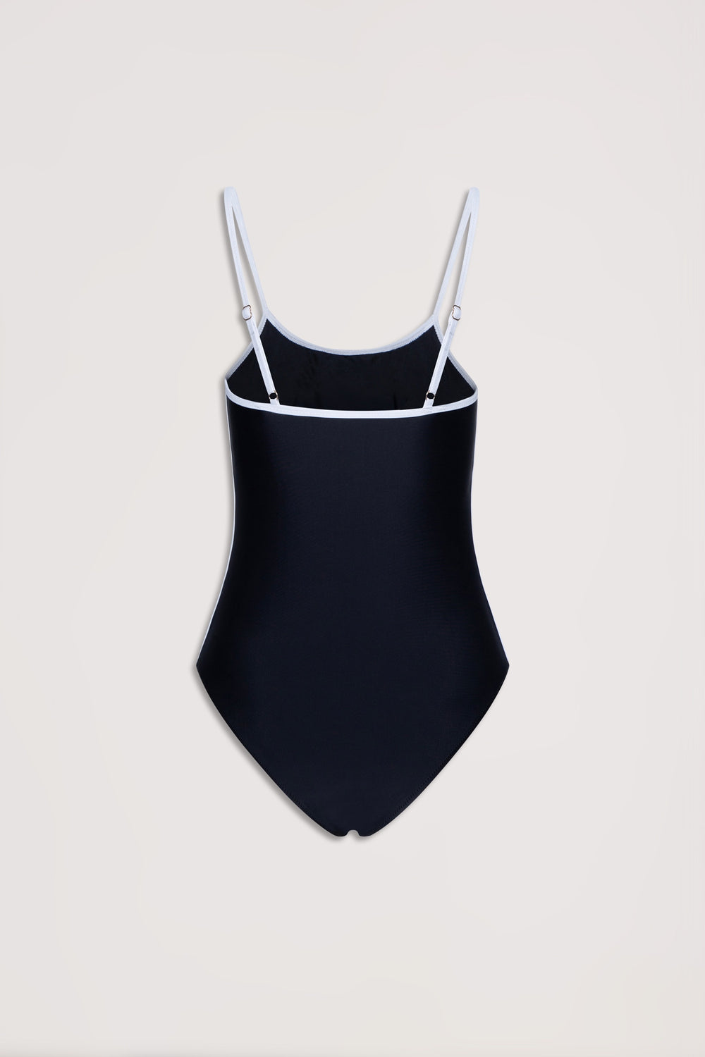 Black one-piece swimsuit with white trim and adjustable thin straps on a neutral background