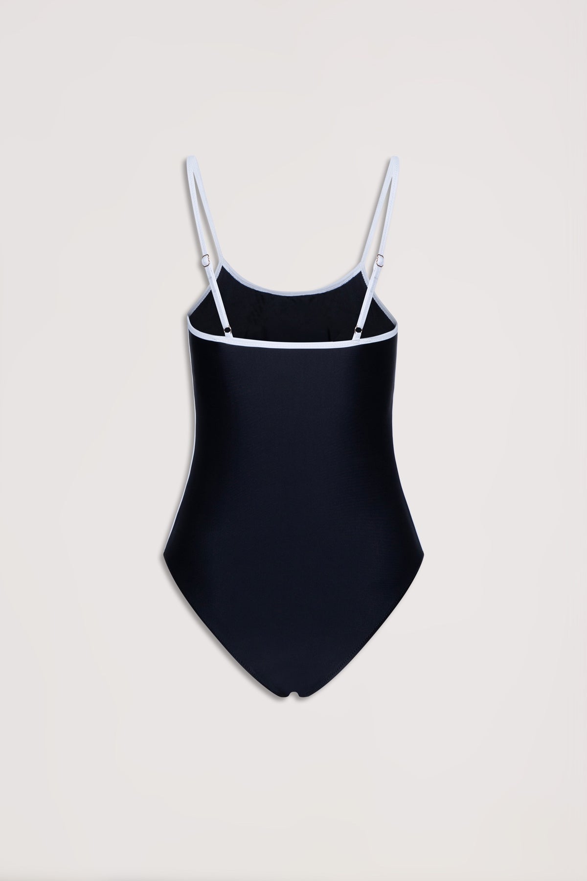 Black one-piece swimsuit with white trim and adjustable thin straps on a neutral background