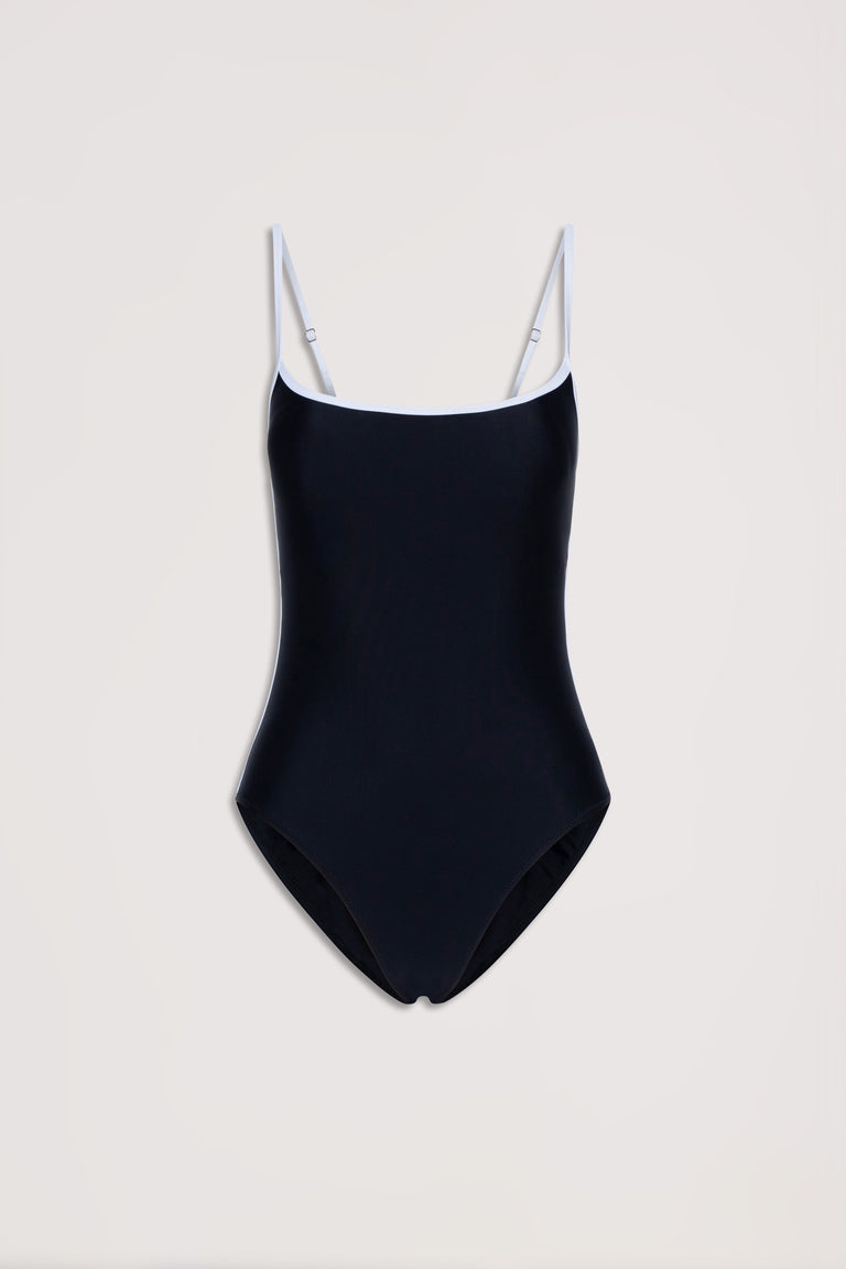 Black one-piece swimsuit with white contrast trim and adjustable thin straps on a neutral background