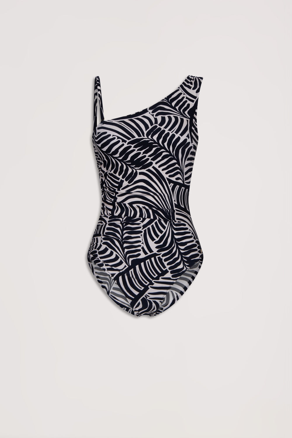 Black and white matte one-shoulder swimsuit with a bold abstract palm leaf pattern on a light background