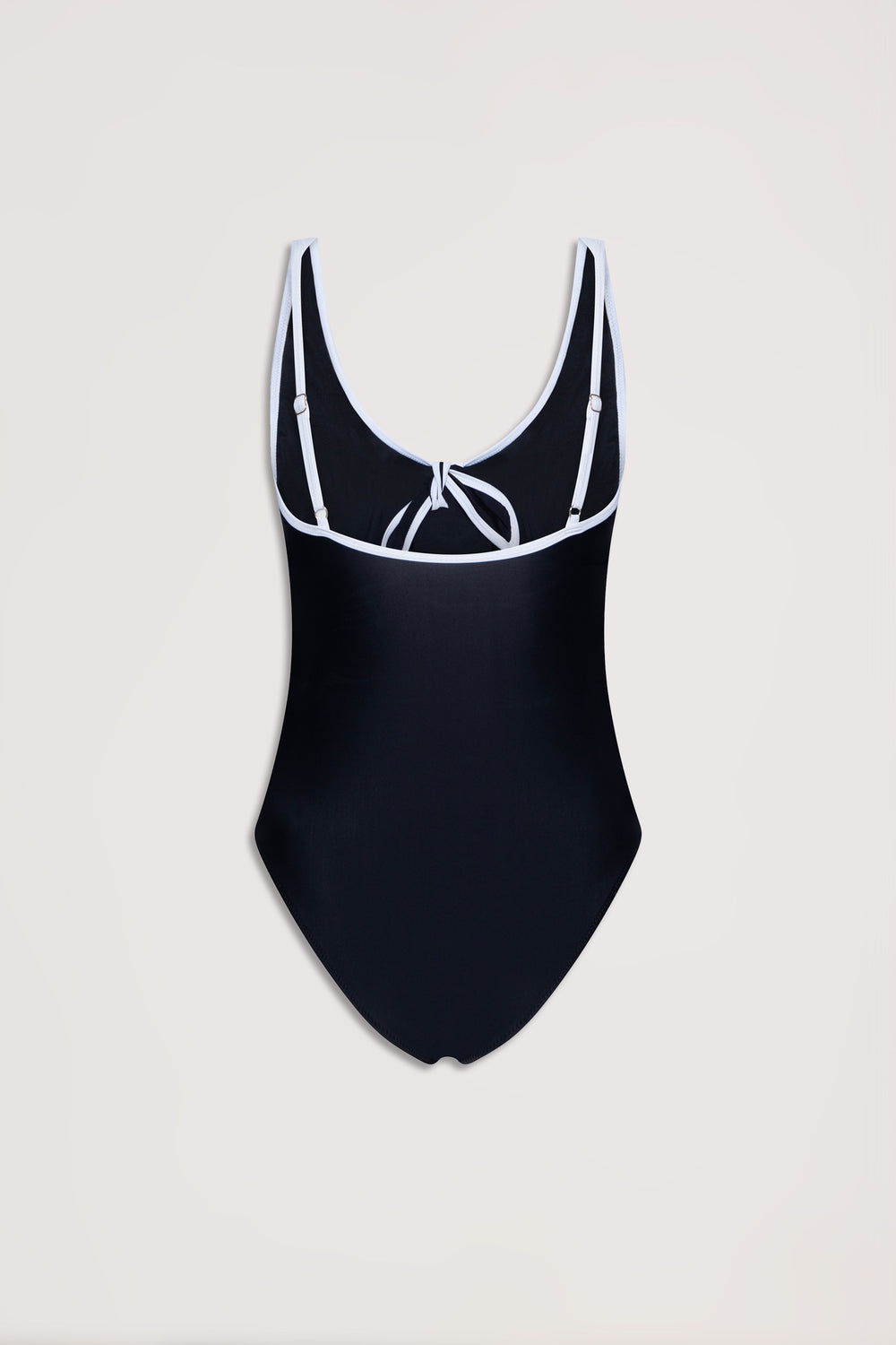 Black one-piece swimsuit with contrast white trim, adjustable straps, and a tie detail at the back neckline