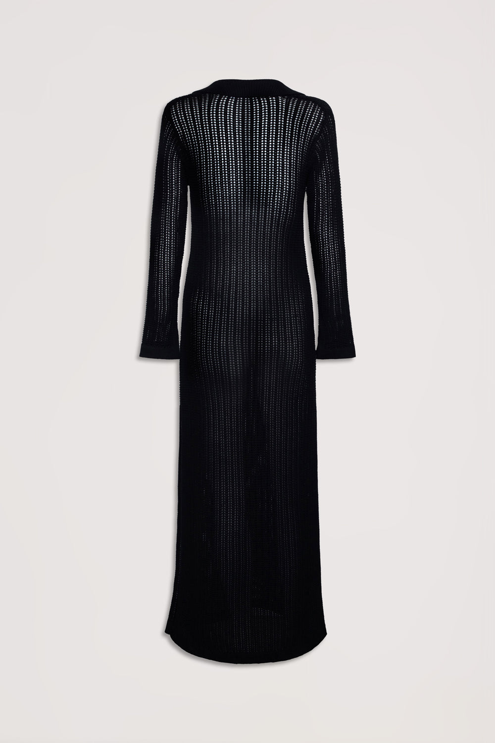 Back view of a long black crochet dress with long sleeves and an open knit pattern for a lightweight feel