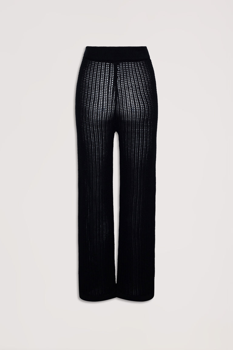 Black crochet pants with a relaxed fit and textured open knit design, styled for effortless everyday wear.