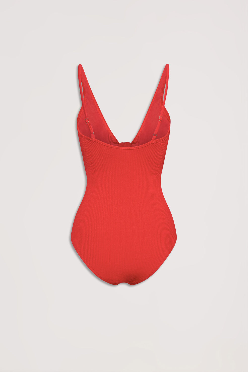 Red textured one-piece swimsuit with adjustable straps and a deep scoop back, laid flat on a neutral background