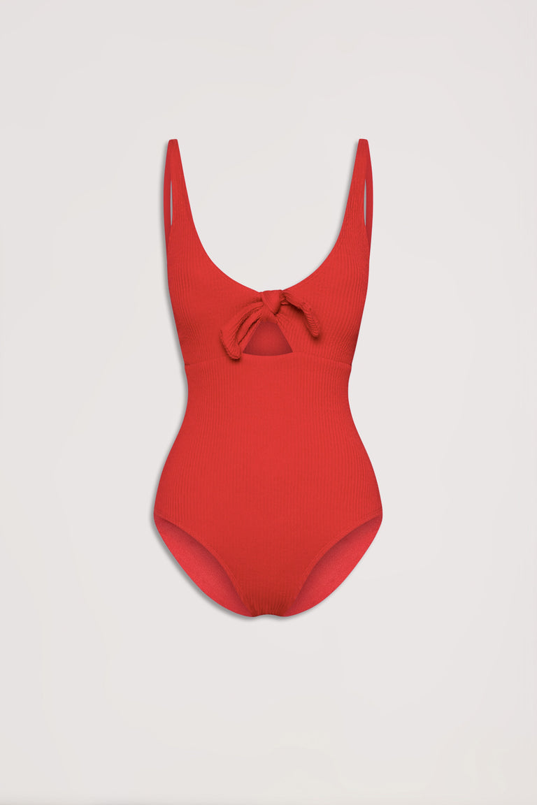 Red crinkle textured one-piece with a front tie detail and low scoop neckline, displayed on plain background