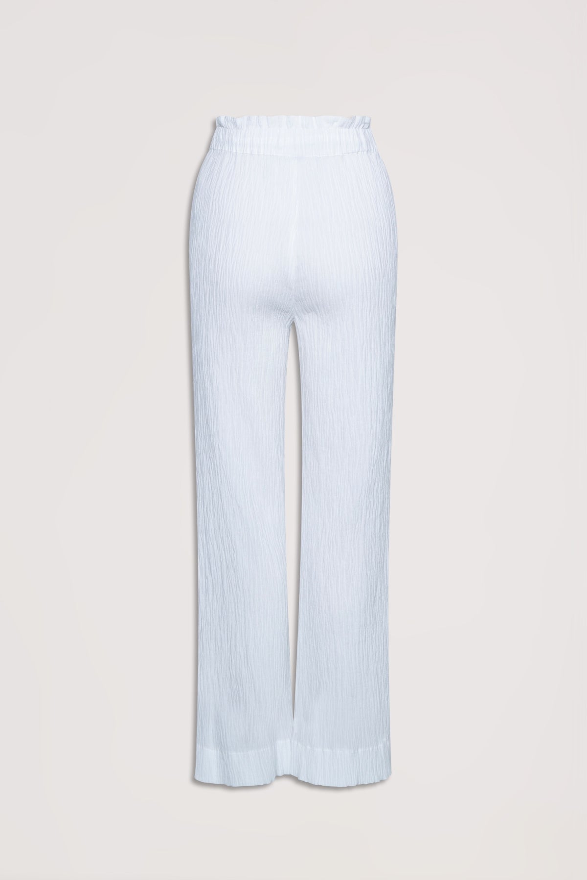 White textured wide-leg pants with an elasticated ruffle waist for a relaxed, effortless style