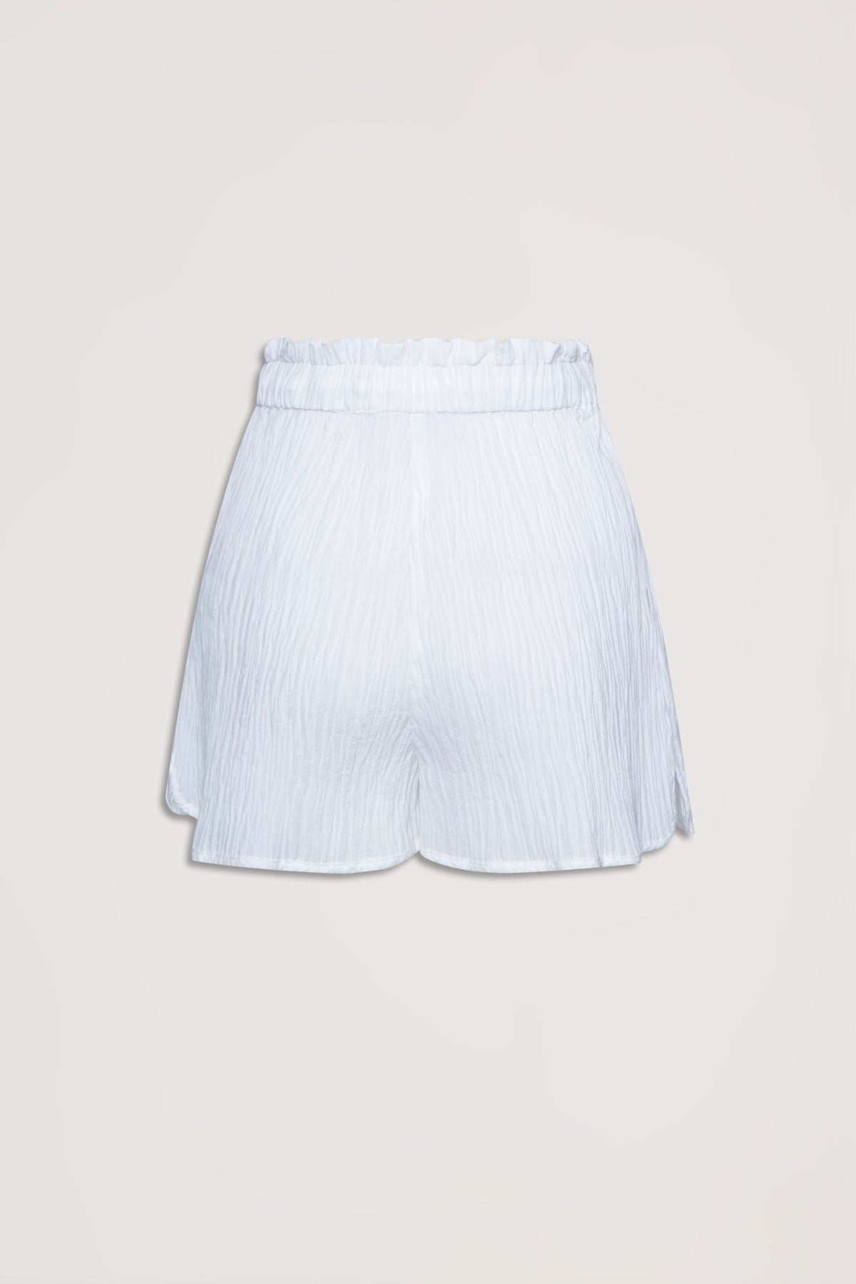 White textured beach shorts with a high, gathered waistband designed for a relaxed, breezy fit