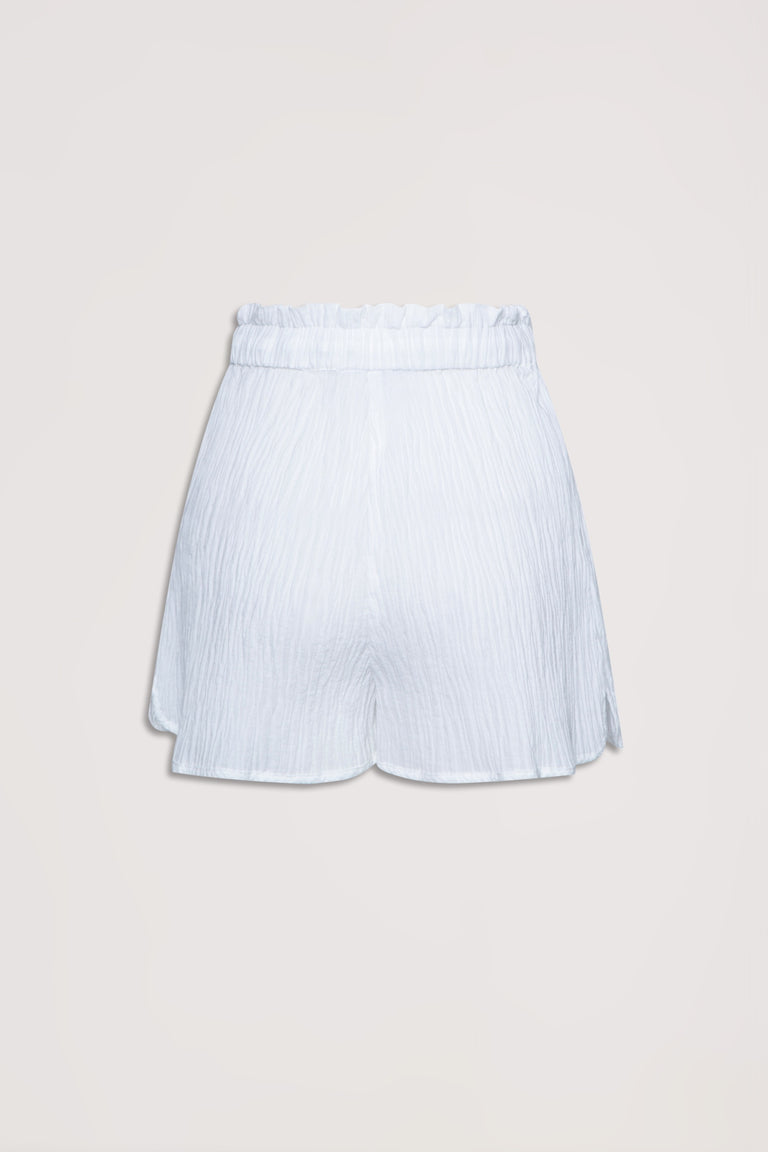 White textured beach shorts with a high, gathered waistband designed for a relaxed, breezy fit
