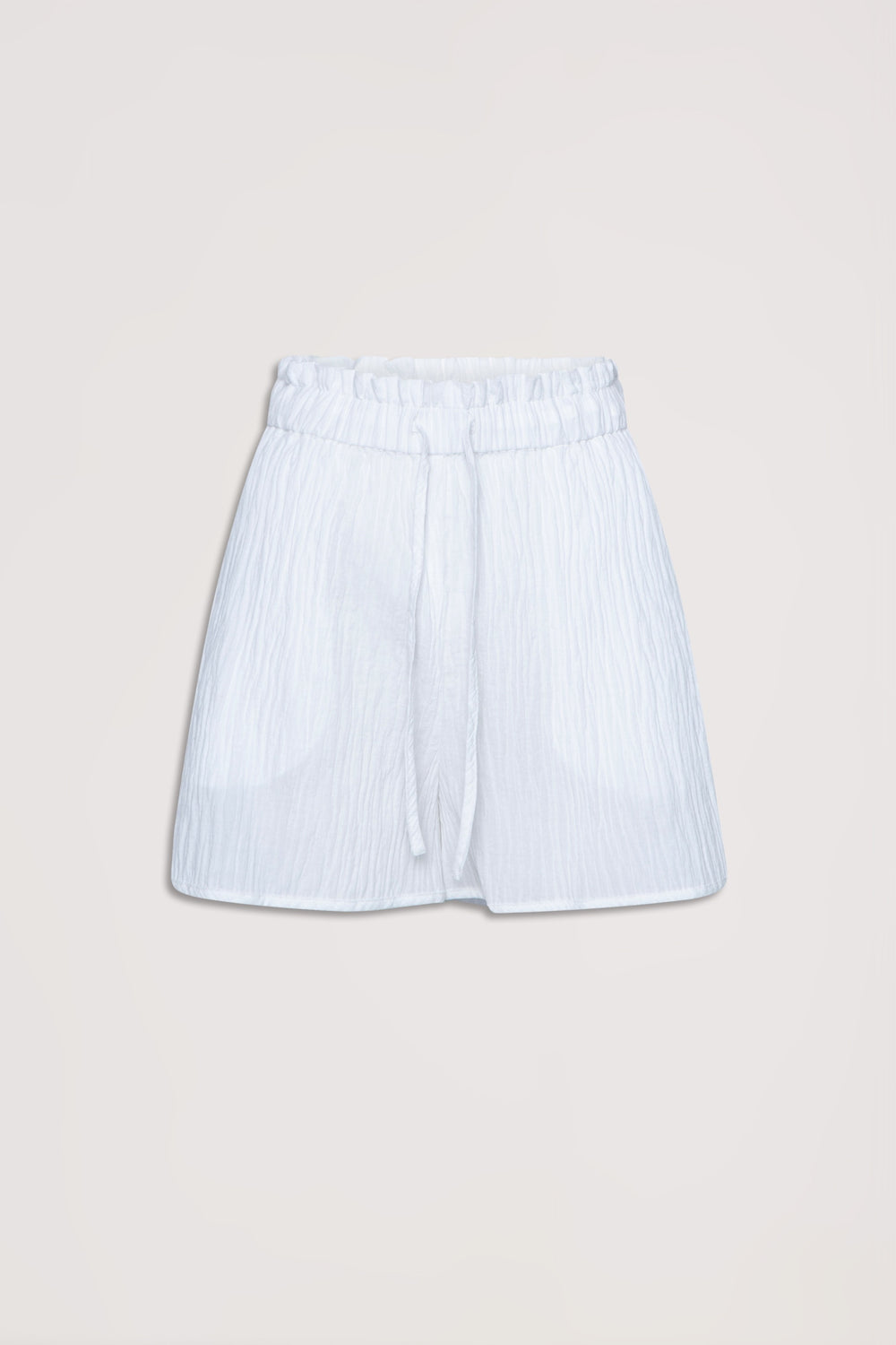 White textured beach shorts with an elastic waist and drawstring, designed for relaxed summer wear.