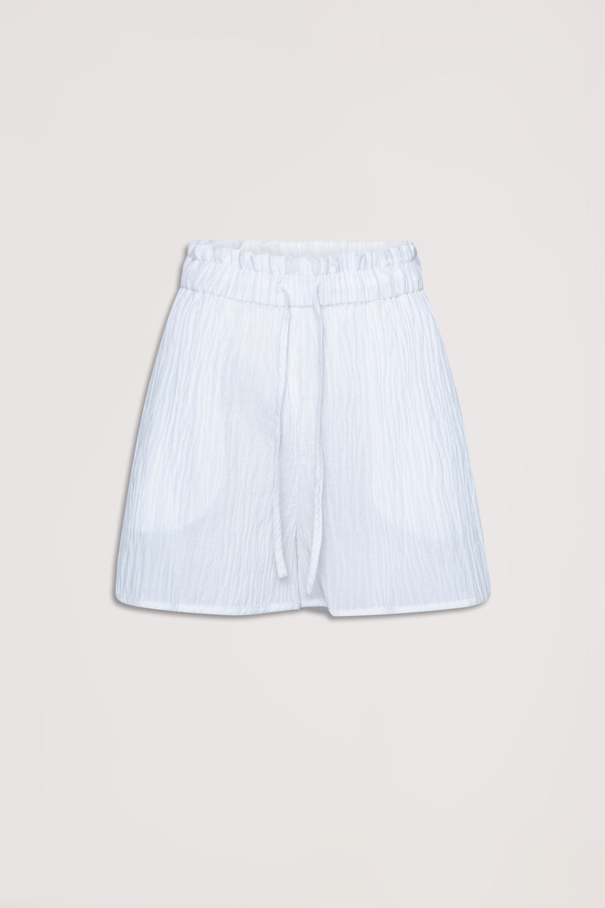 White textured beach shorts with an elastic waist and drawstring, designed for relaxed summer wear.