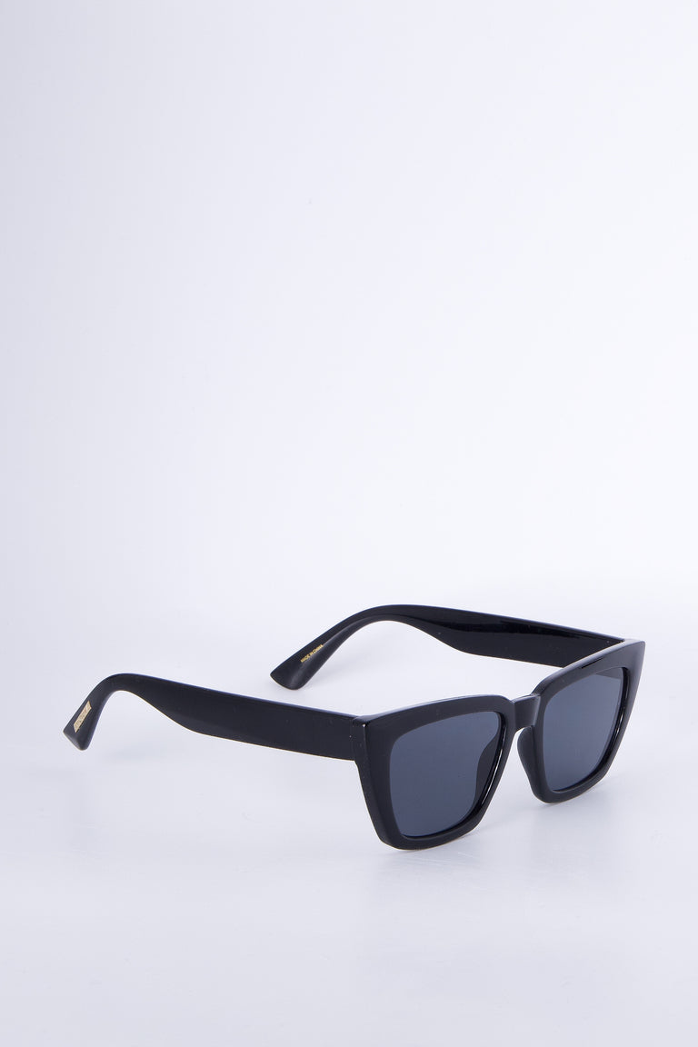 Stylish black cat eye sunglasses with angled frames and dark lenses for a chic, modern accessory look.