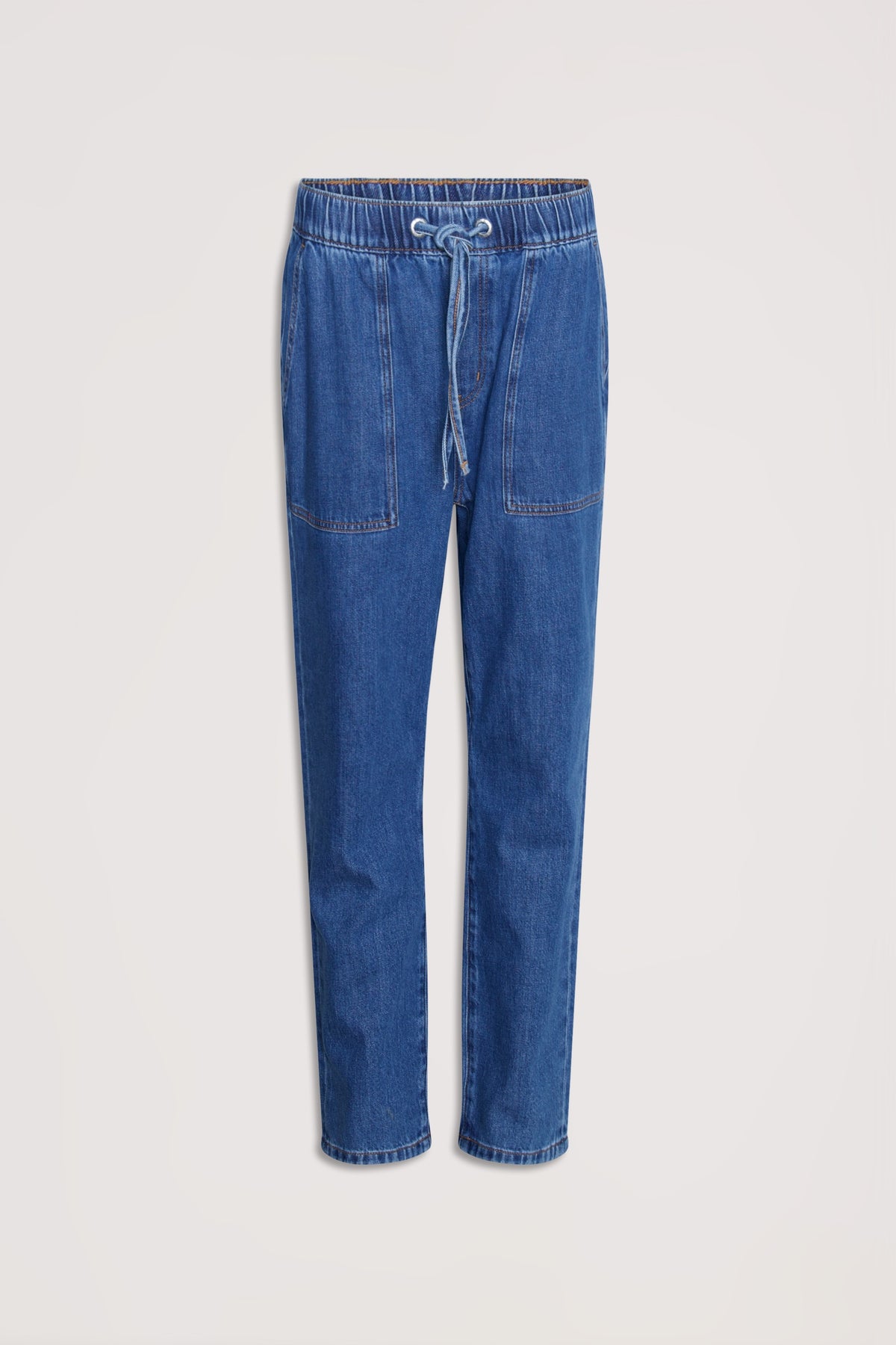 Relaxed fit blue denim joggers with an elasticated waistband and front patch pockets for casual, comfortable wear.