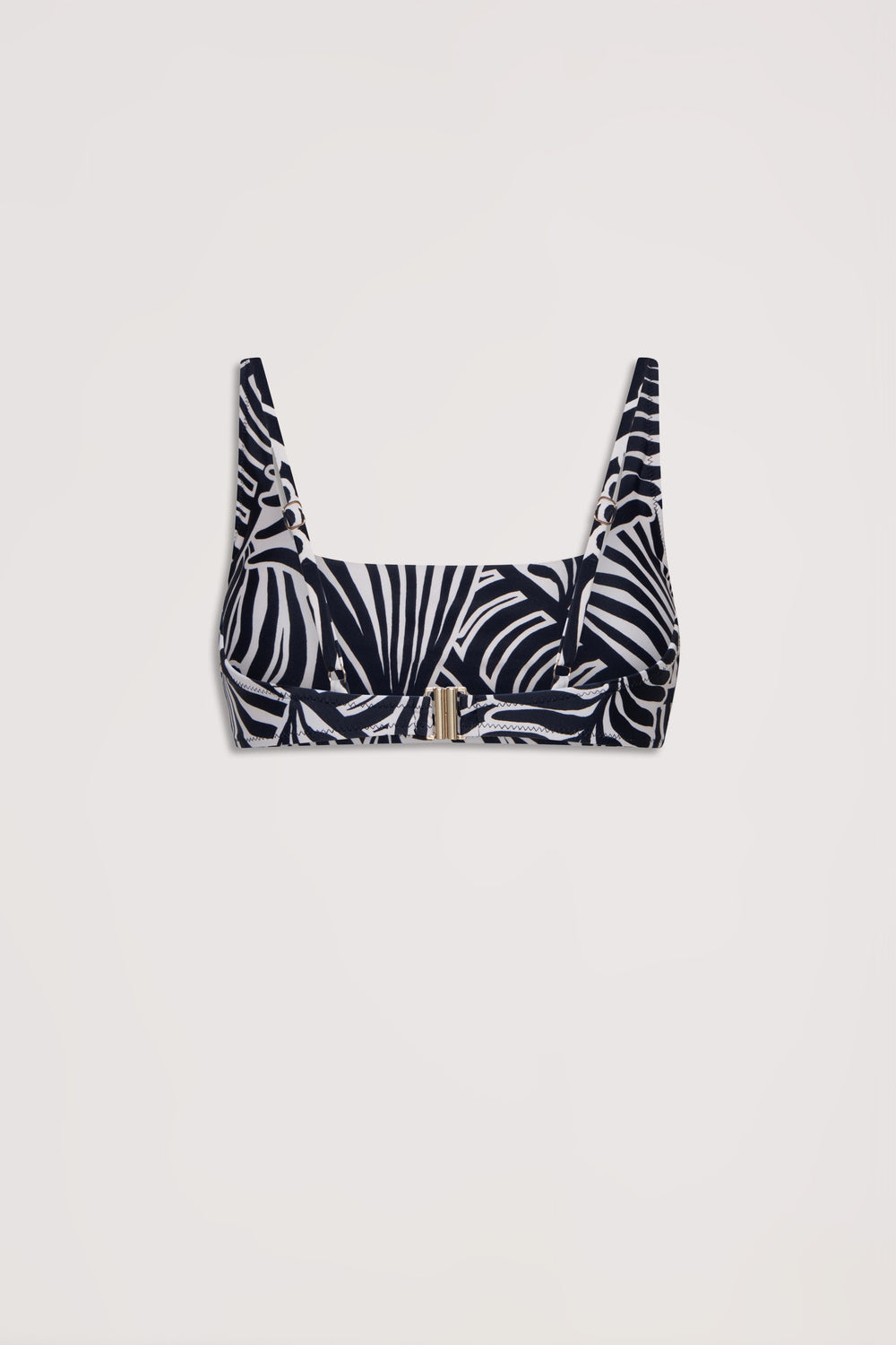Black and white tropical leaf patterned bikini top with a modern square neckline and structured fit