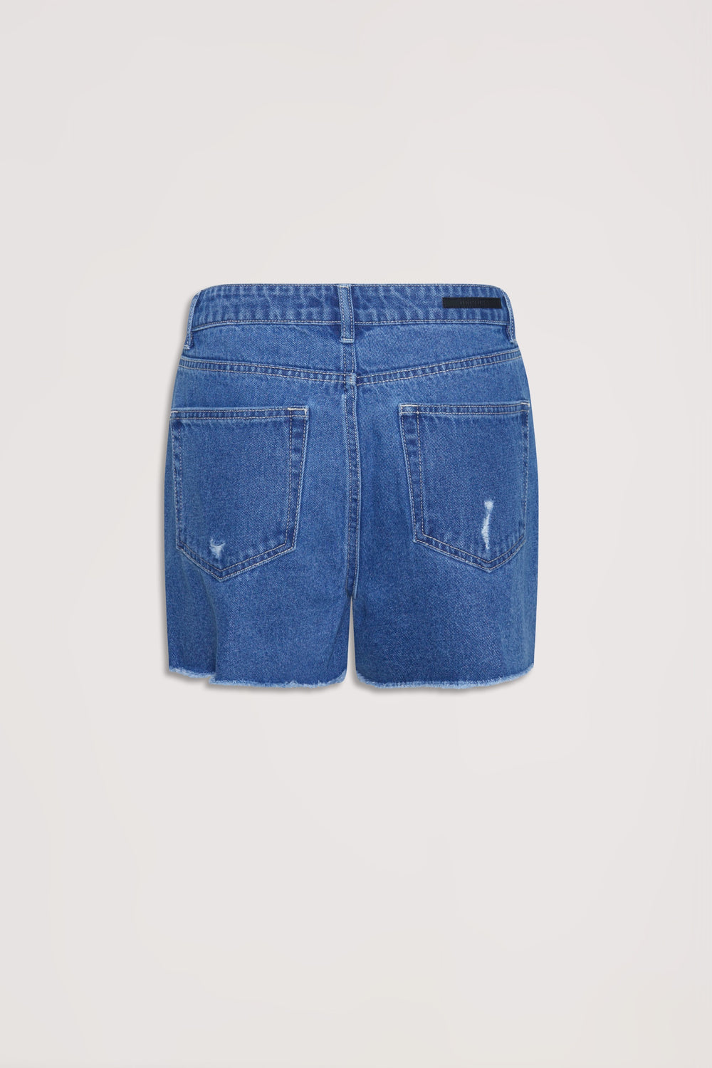 Back view of bright blue distressed denim shorts with raw hem and patch pockets against a plain background