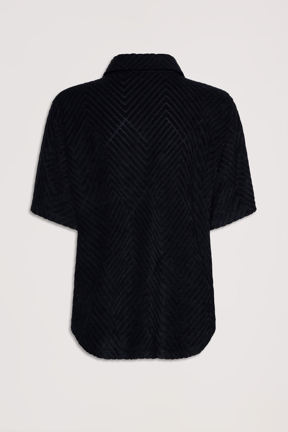 Black terry fabric shirt with chevron texture and short sleeves, shown from the back with a relaxed fit collar.