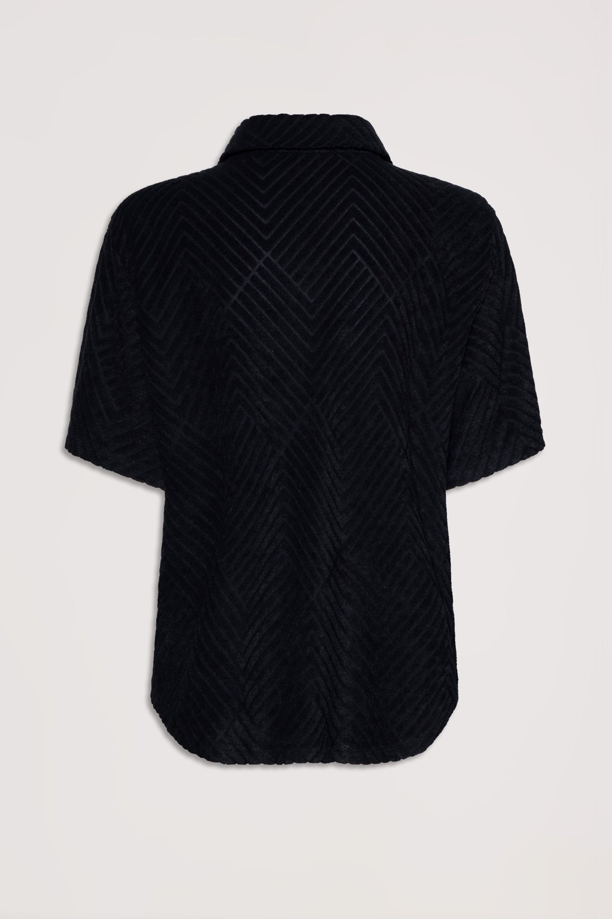 Black terry fabric shirt with chevron texture and short sleeves, shown from the back with a relaxed fit collar.