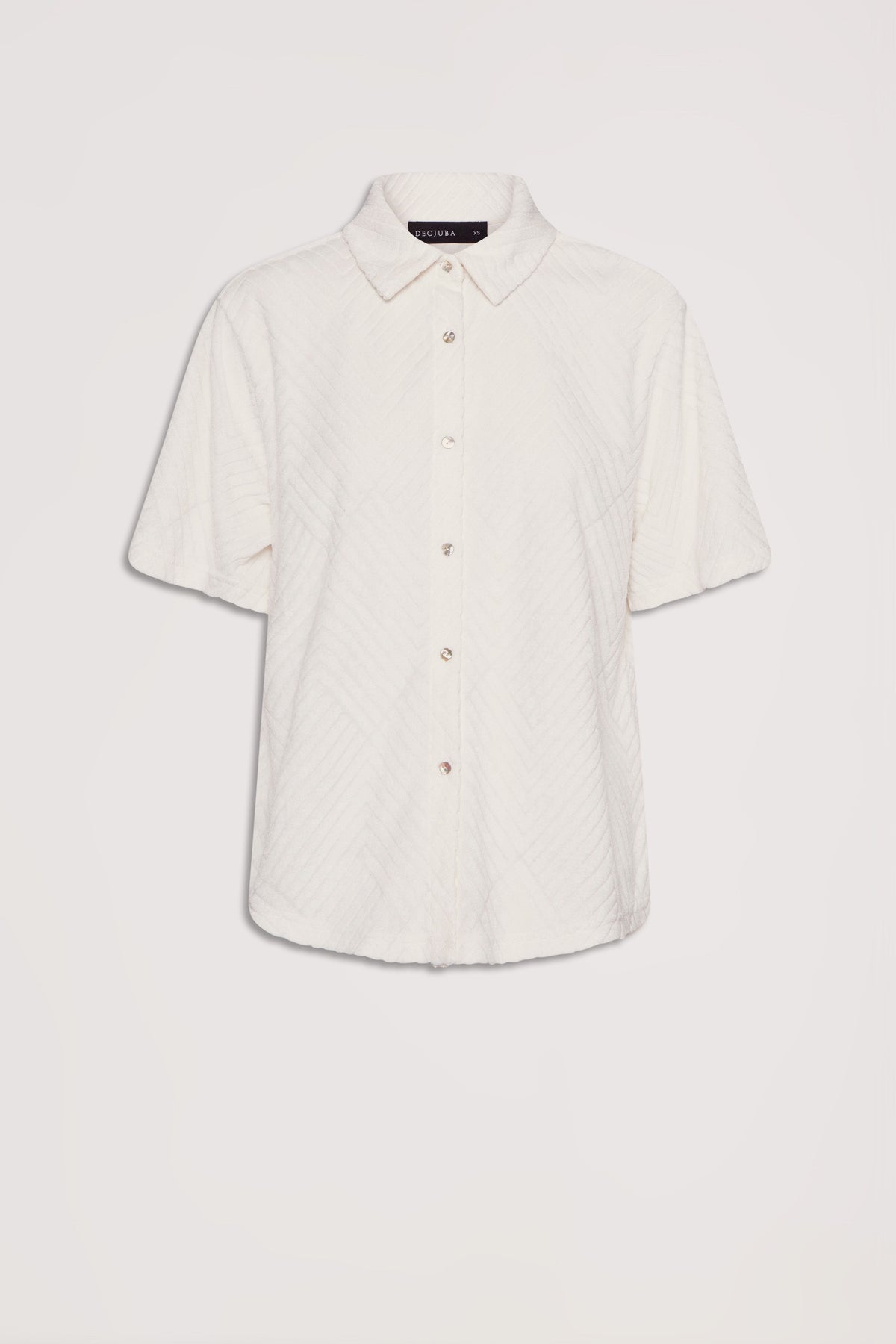Cream-colored short sleeve shirt with subtle textured pattern and button front, featuring a classic collar design
