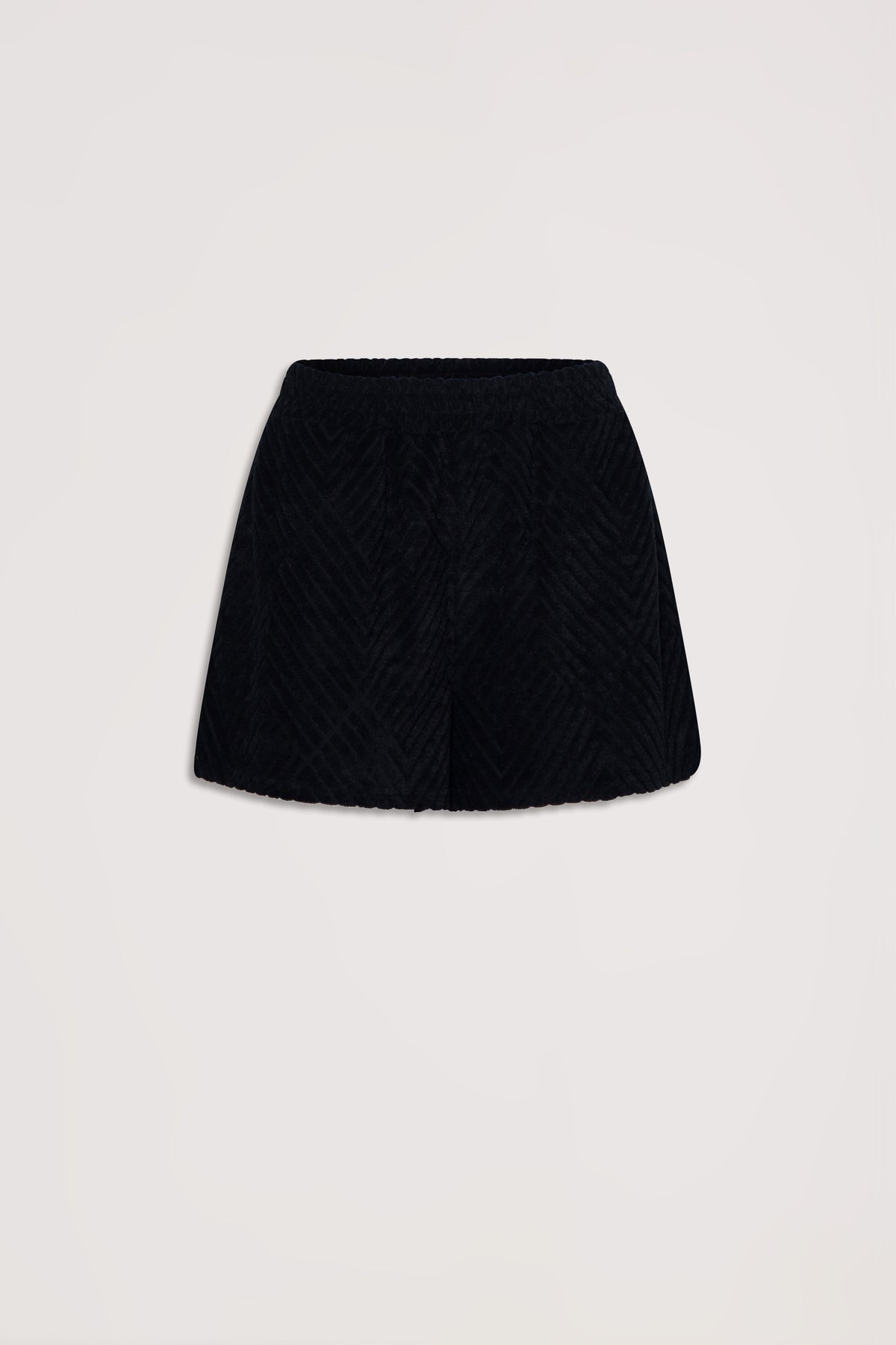 Black textured terry shorts with a relaxed fit and elastic waistband against a neutral background