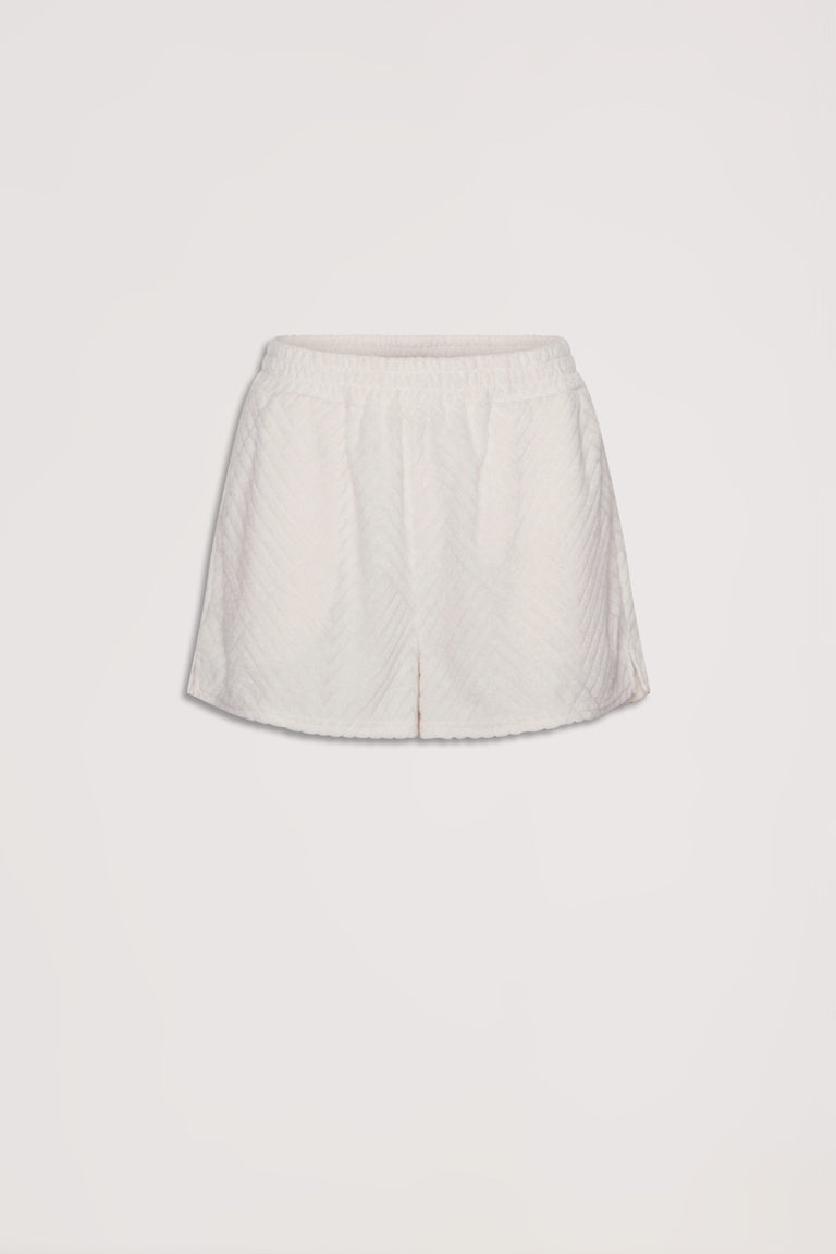 Cream textured shorts with an elastic waistband, designed for effortless everyday comfort and style.