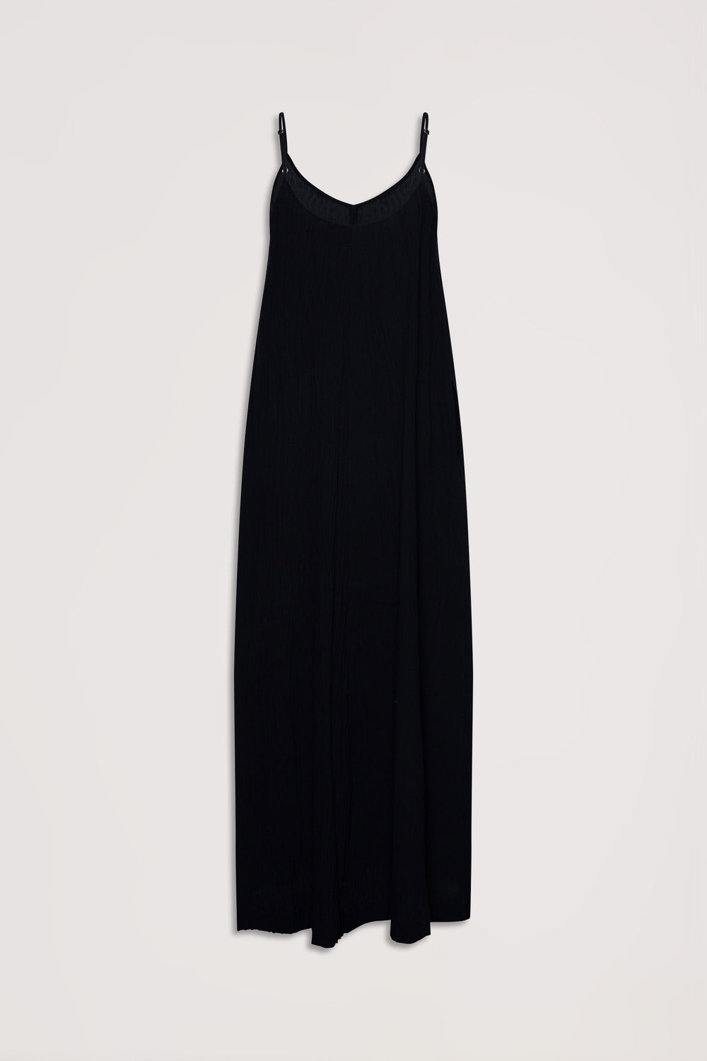 Black sleeveless maxi dress with thin adjustable straps and a flowing, relaxed fit for effortless style