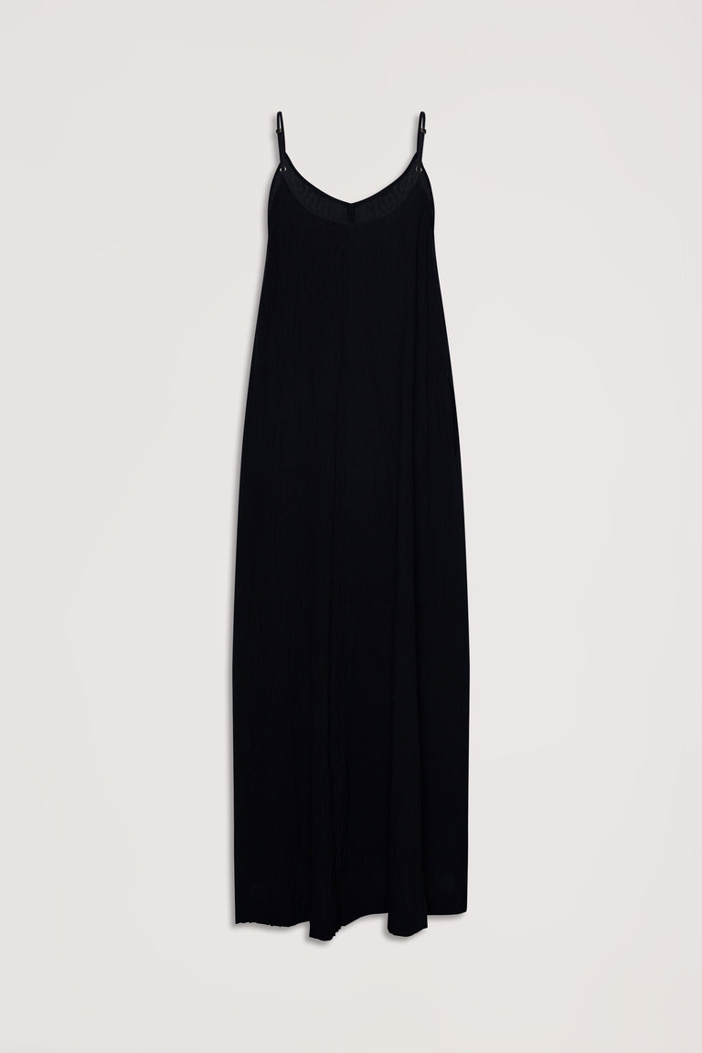 Black sleeveless maxi dress with thin adjustable straps and a flowing, relaxed fit for effortless style