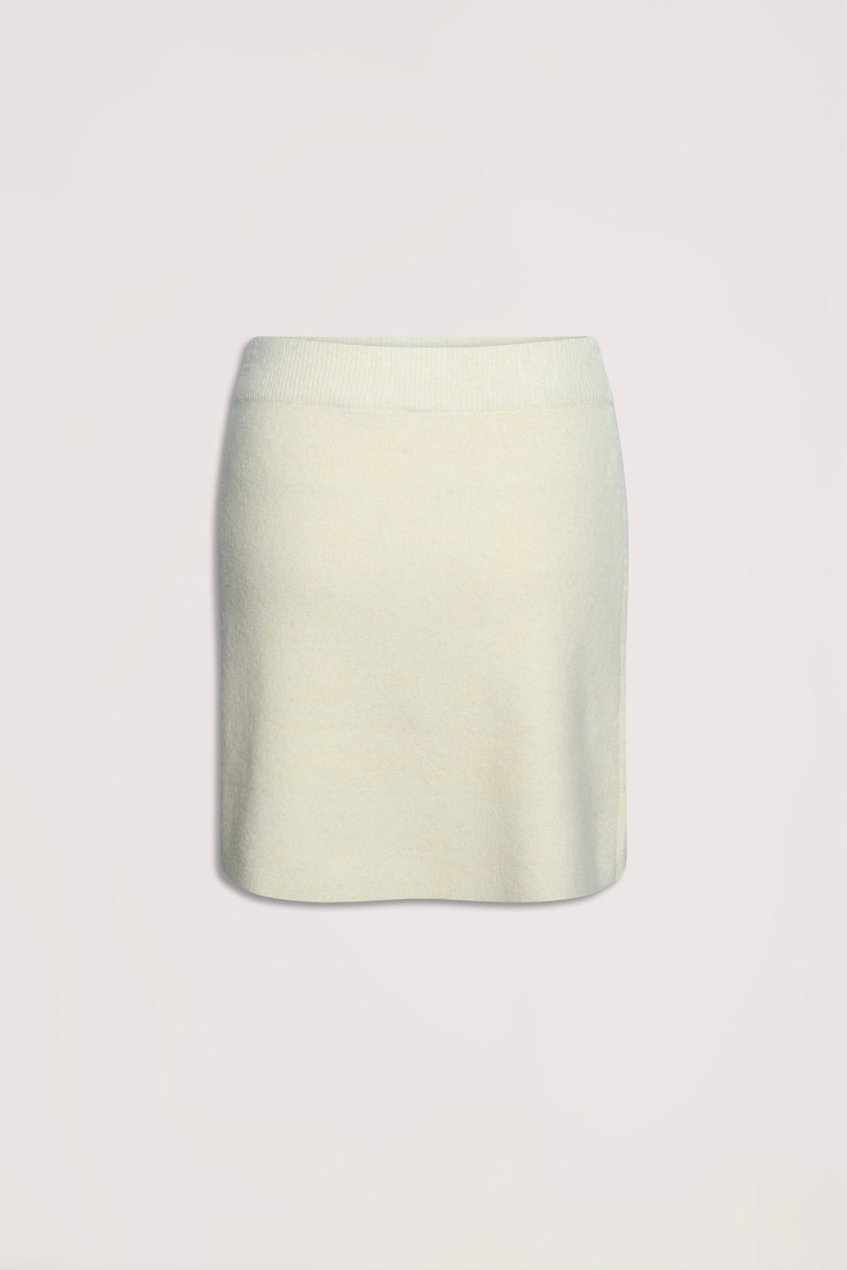 Cream-colored knit mini skirt with a soft texture and elastic waistband for comfortable everyday wear