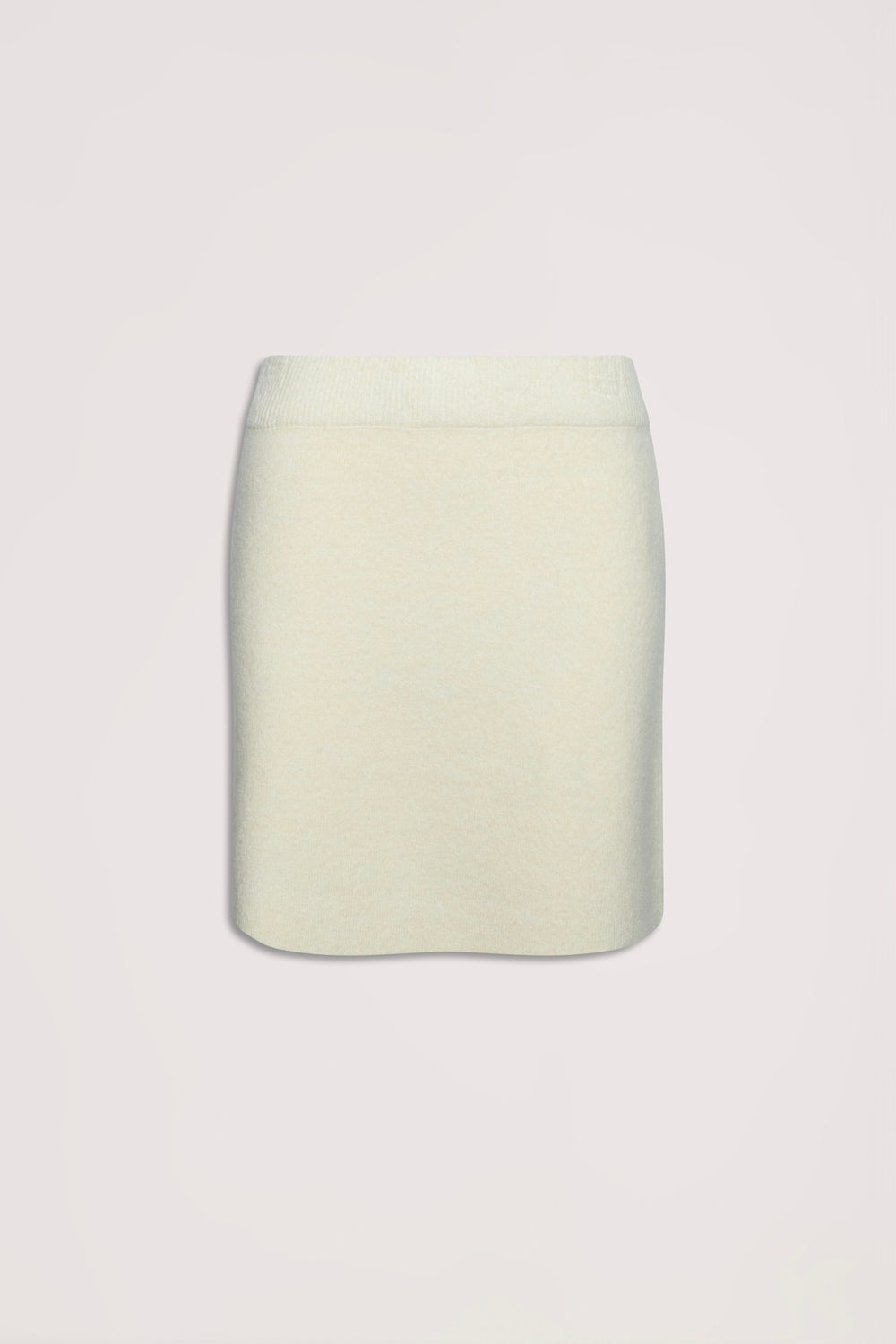Cream-colored knit mini skirt with a streamlined silhouette, ideal for versatile everyday wear.