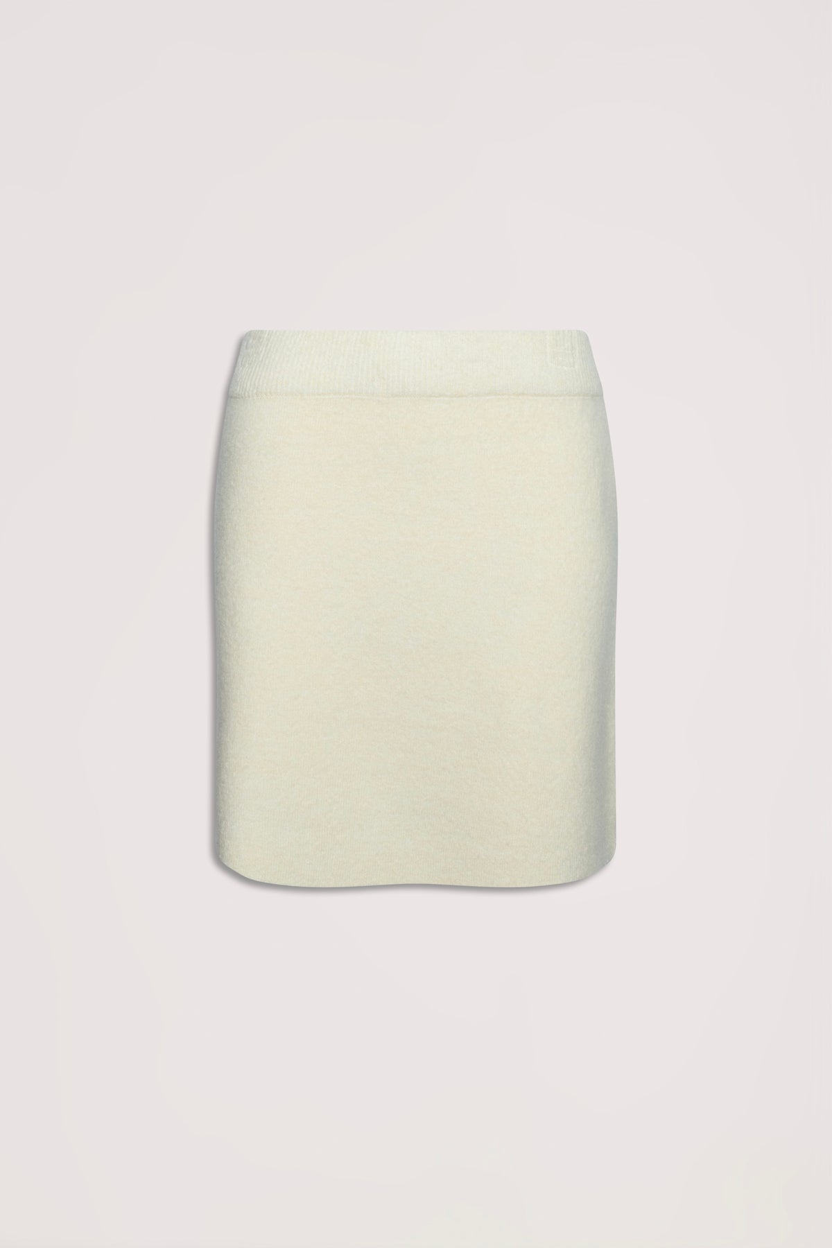 Cream-colored knit mini skirt with a streamlined silhouette, ideal for versatile everyday wear.