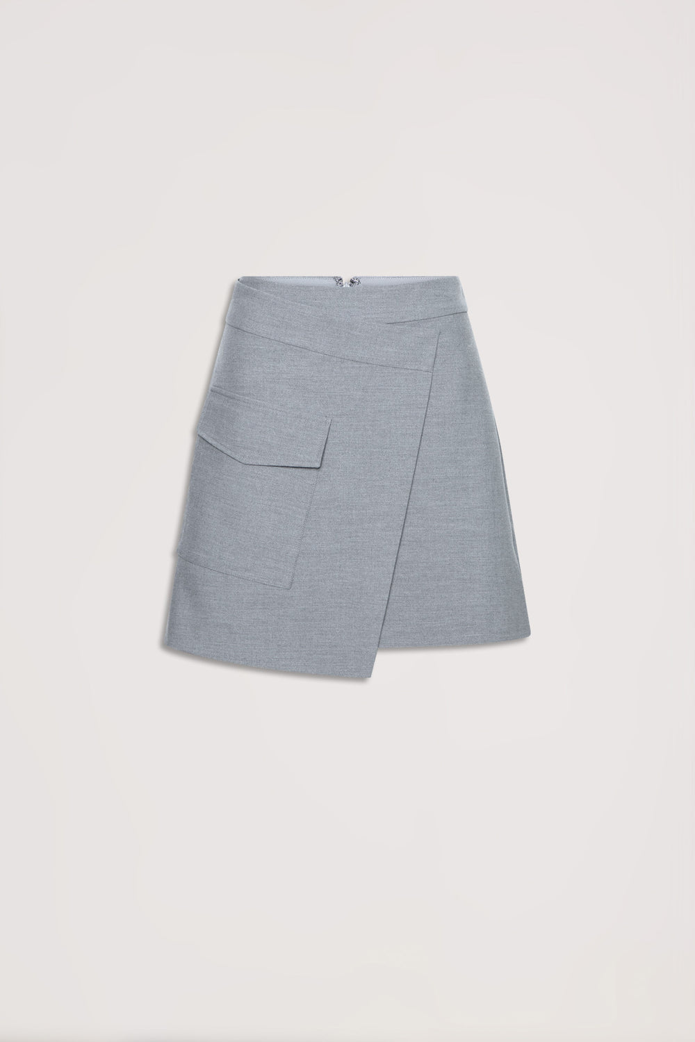 Light grey asymmetric mini skirt with front flap pocket and concealed back zipper, laid flat on neutral background