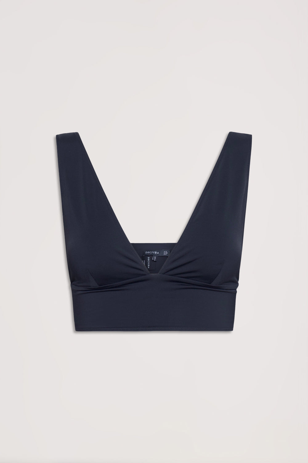 Black bralette with a deep V neckline, wide straps, and a wide hem band for a neat, stretchy fit.