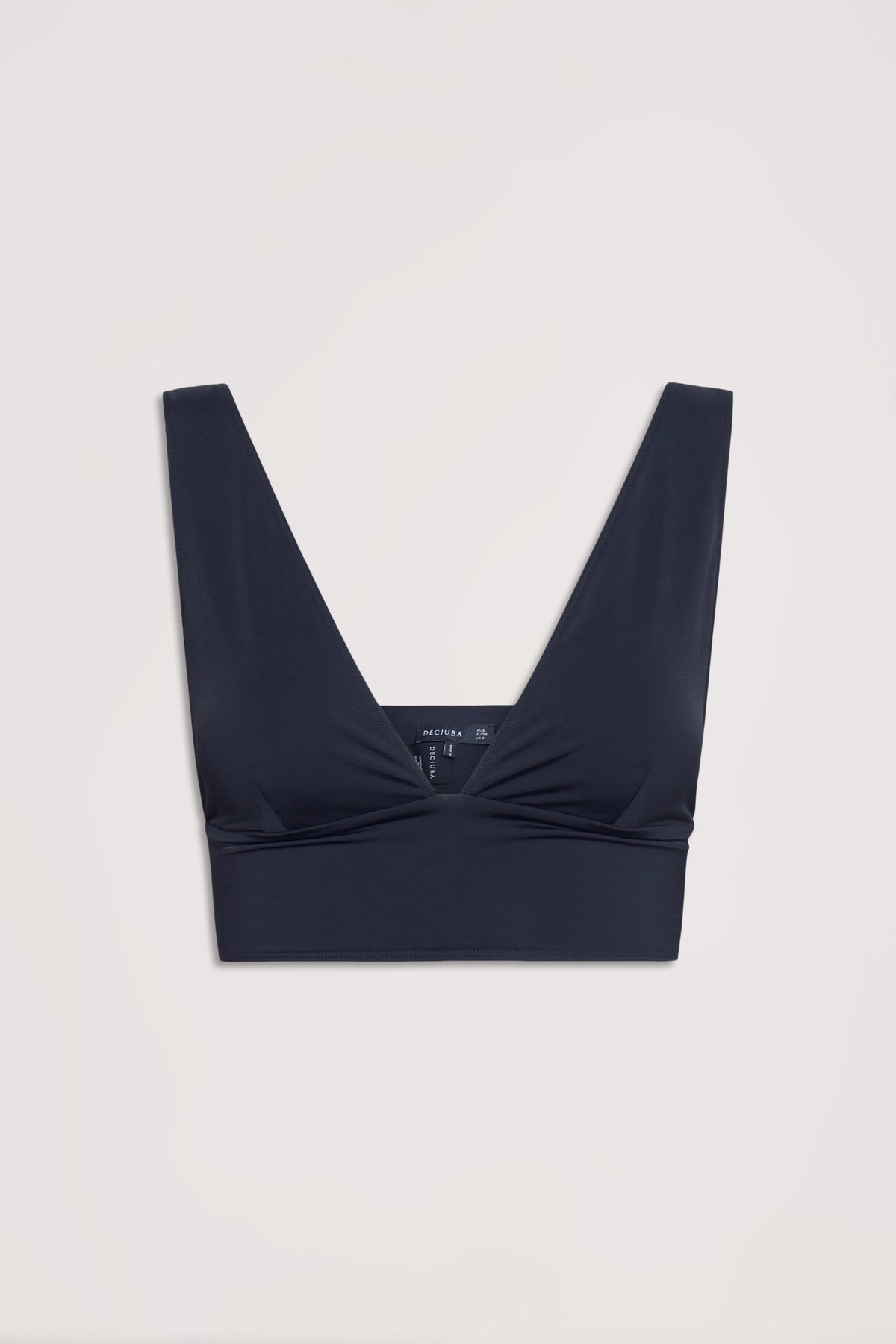 Black bralette with a deep V neckline, wide straps, and a wide hem band for a neat, stretchy fit.