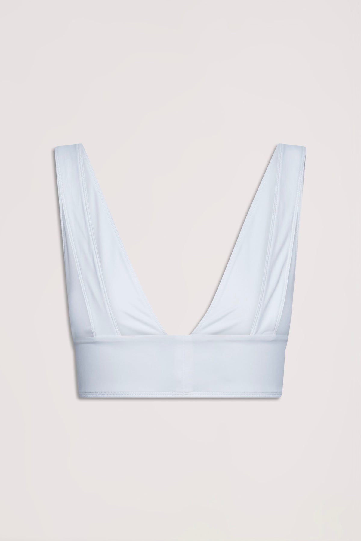 Ivory bralette with wide straps and deep V neckline designed for a neat, comfortable fit in stretch fabric.
