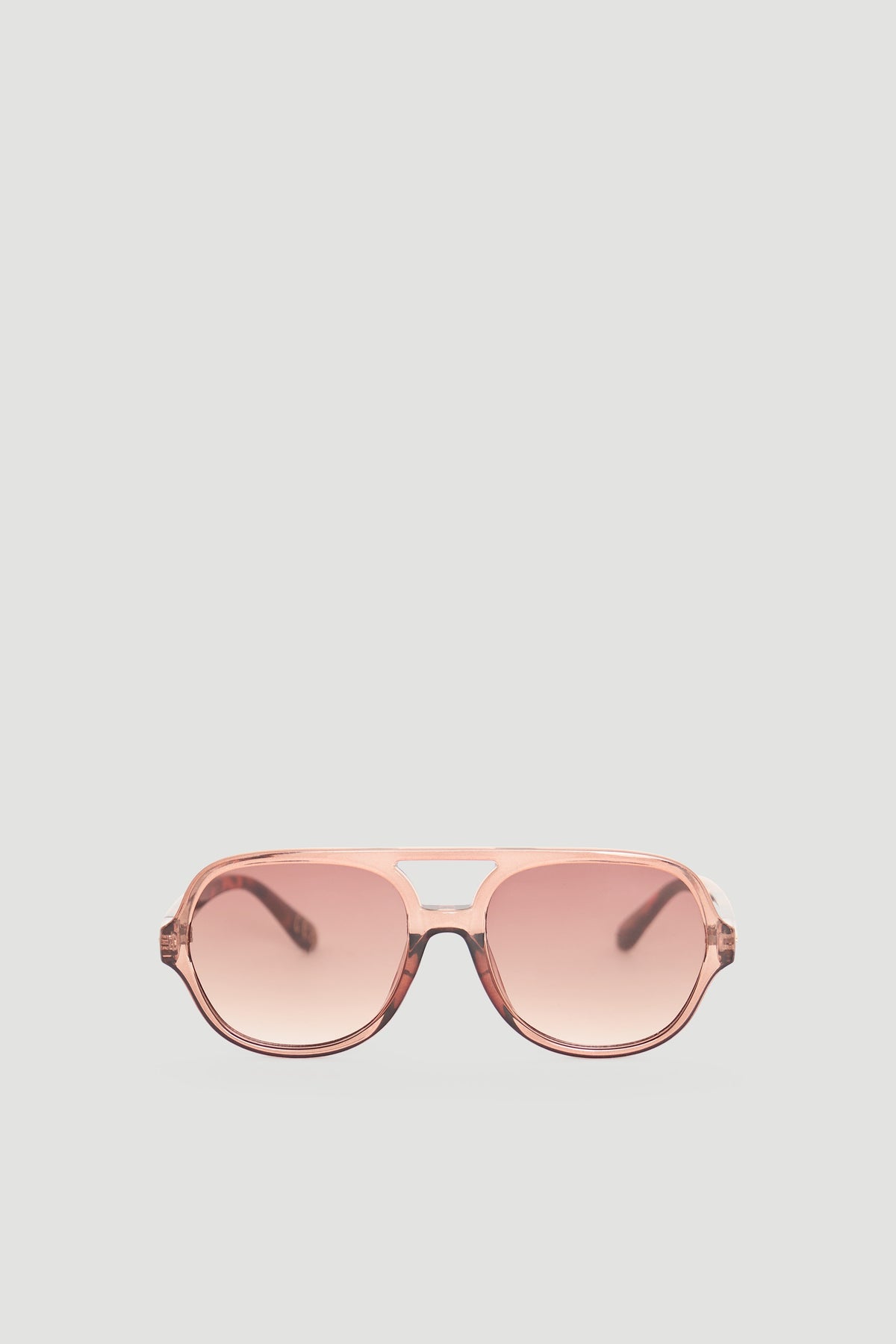 Sleek aviator sunglasses in a soft pink gradient offering a modern and stylish accessory for everyday wear