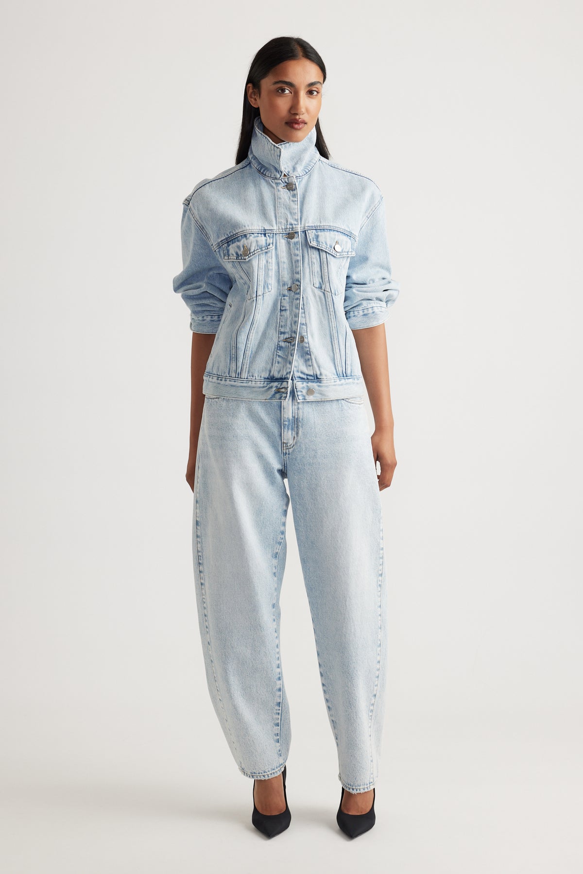 Woman wearing Camille Barrel Leg Jean in light denim paired with matching jacket by Decjuba Australian fashion brand
