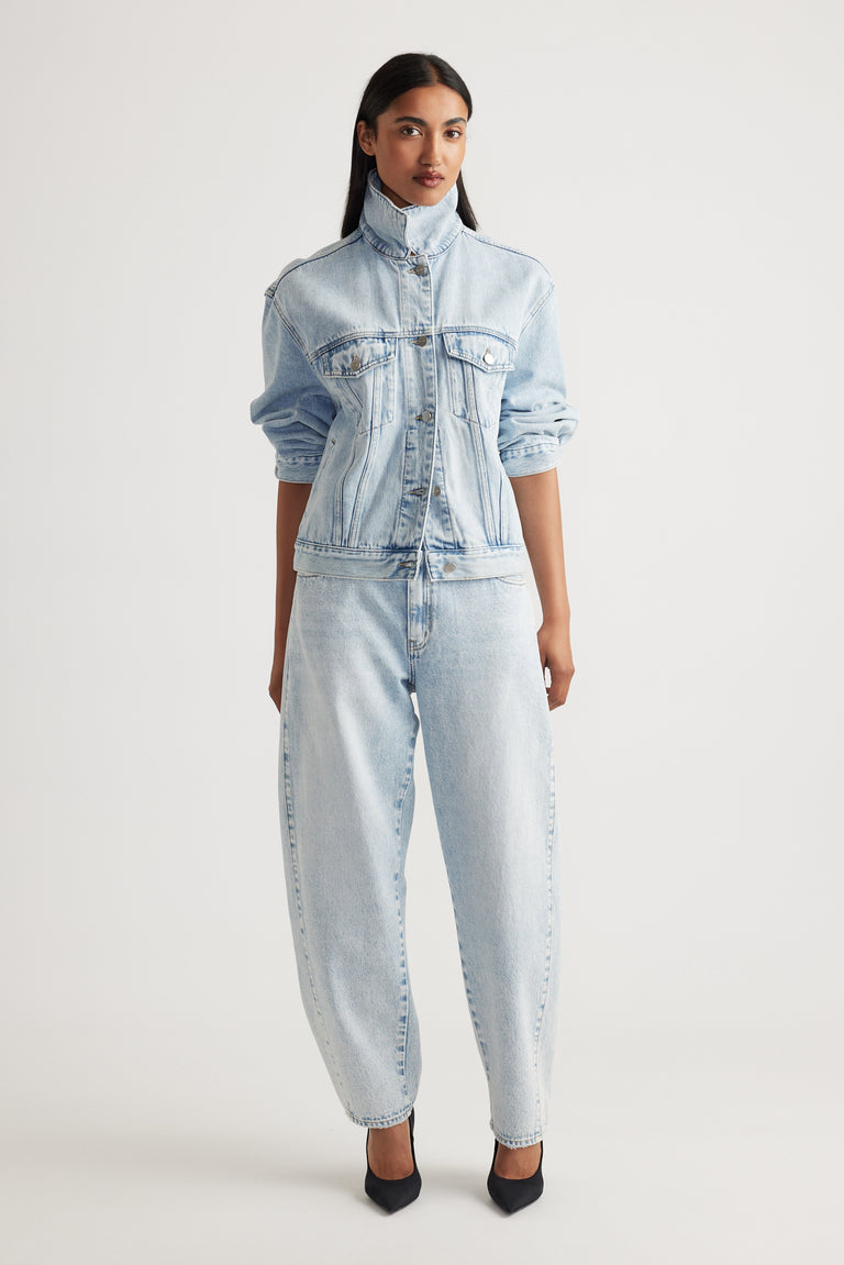 Woman wearing Camille Barrel Leg Jean in light denim paired with matching jacket by Decjuba Australian fashion brand
