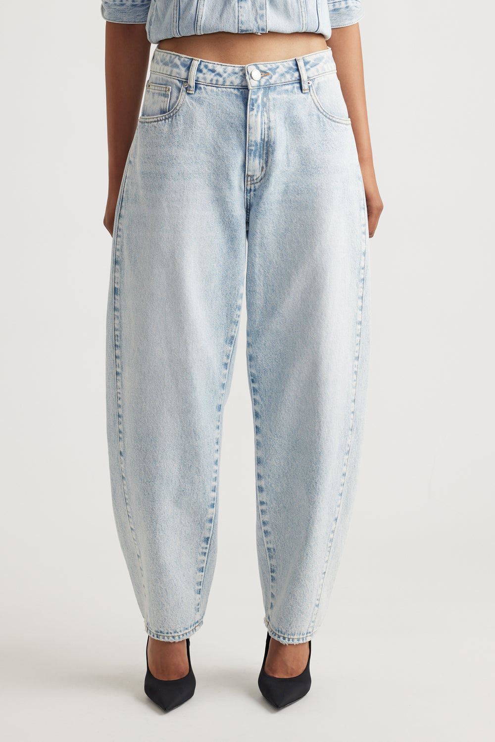 Front view of Camille Barrel Leg Jean in light washed denim with relaxed fit styled by Decjuba Australian fashion brand