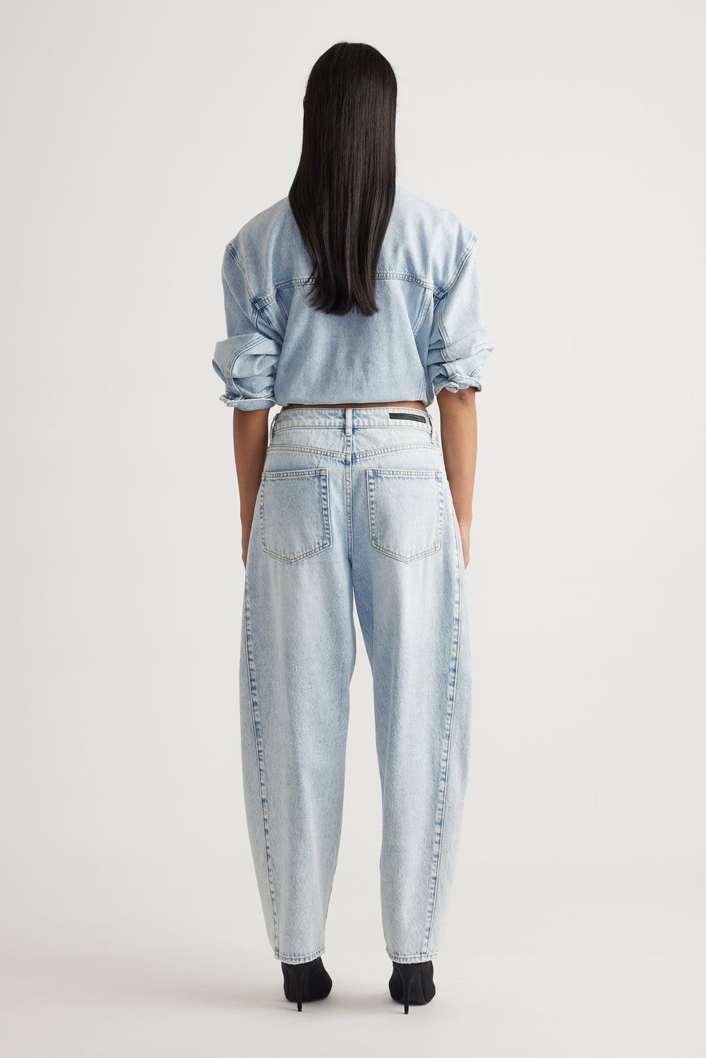 Rear view of Camille Barrel Leg Jean in light denim with relaxed fit styled by Decjuba Australian fashion brand