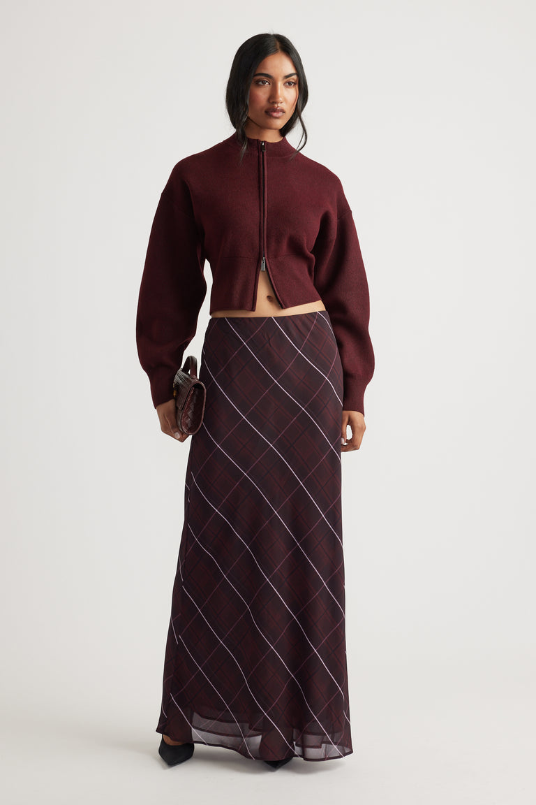 Zoey Zip Knit Jumper in rich burgundy with balloon sleeves, styled with a dark plaid maxi skirt by Decjuba Australian fashion brand