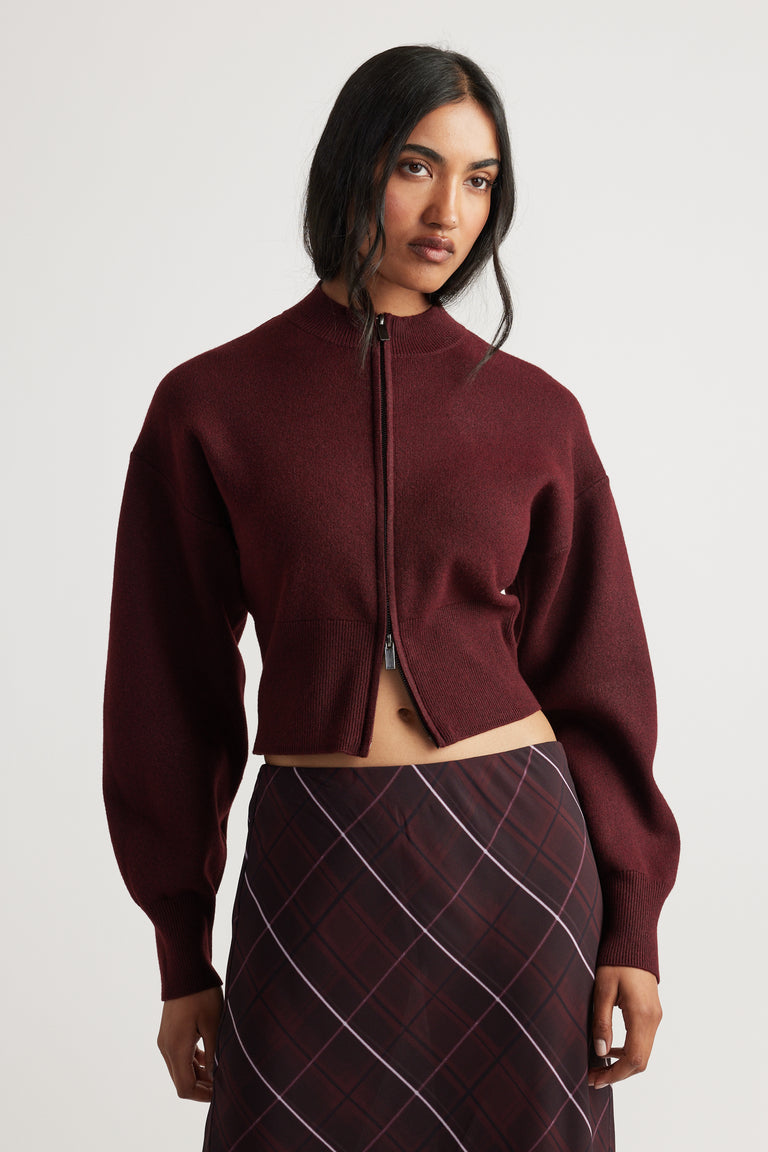 Zoey Zip Knit Jumper in deep burgundy with balloon sleeves and front zip, a versatile piece by Decjuba Australian brand