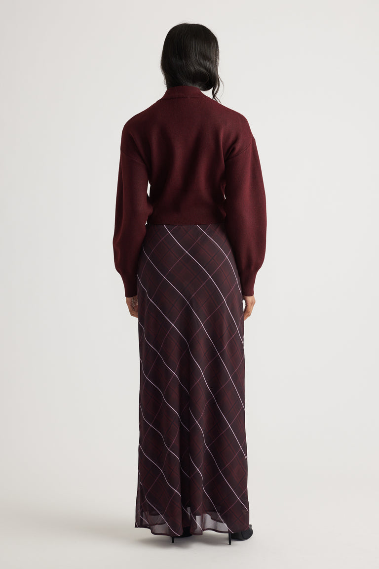 Back view of Zoey Zip Knit Jumper in deep burgundy paired with a flowy plaid maxi skirt by Decjuba Australian brand