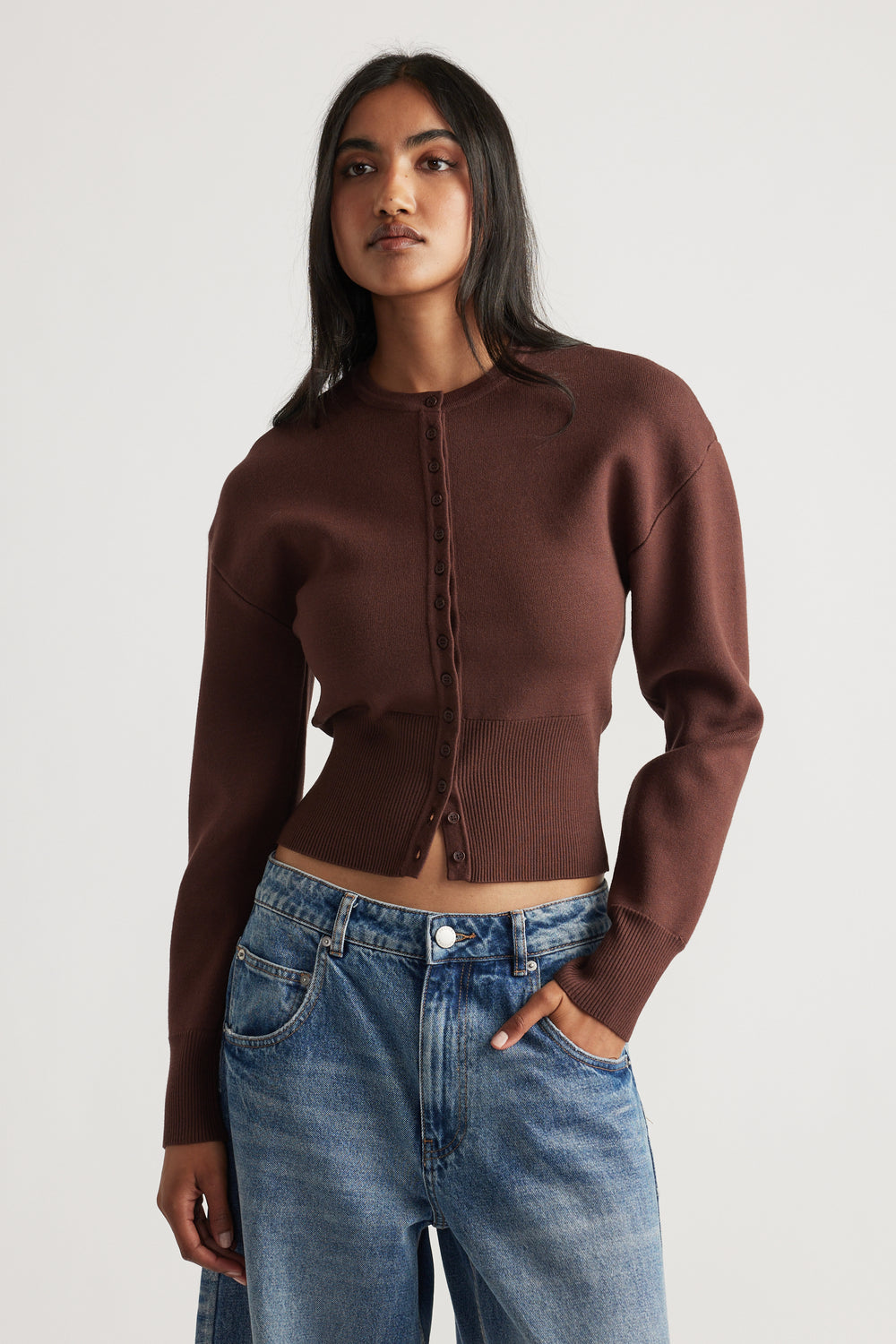 Slim-fit rich mocha cardigan with button front and cinched waist paired with relaxed blue denim jeans