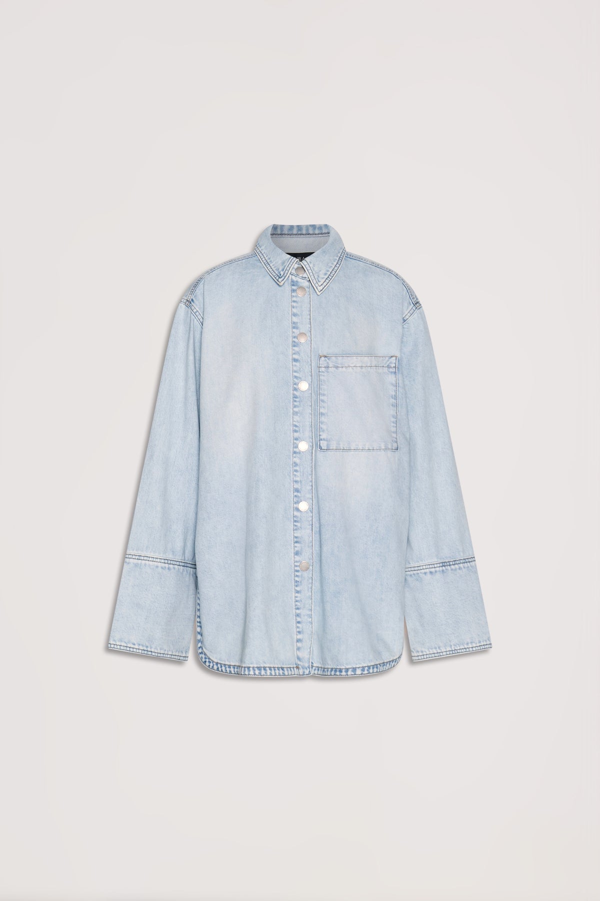 Light wash denim shirt with long sleeves, front buttons, and a single chest pocket for a relaxed everyday look.