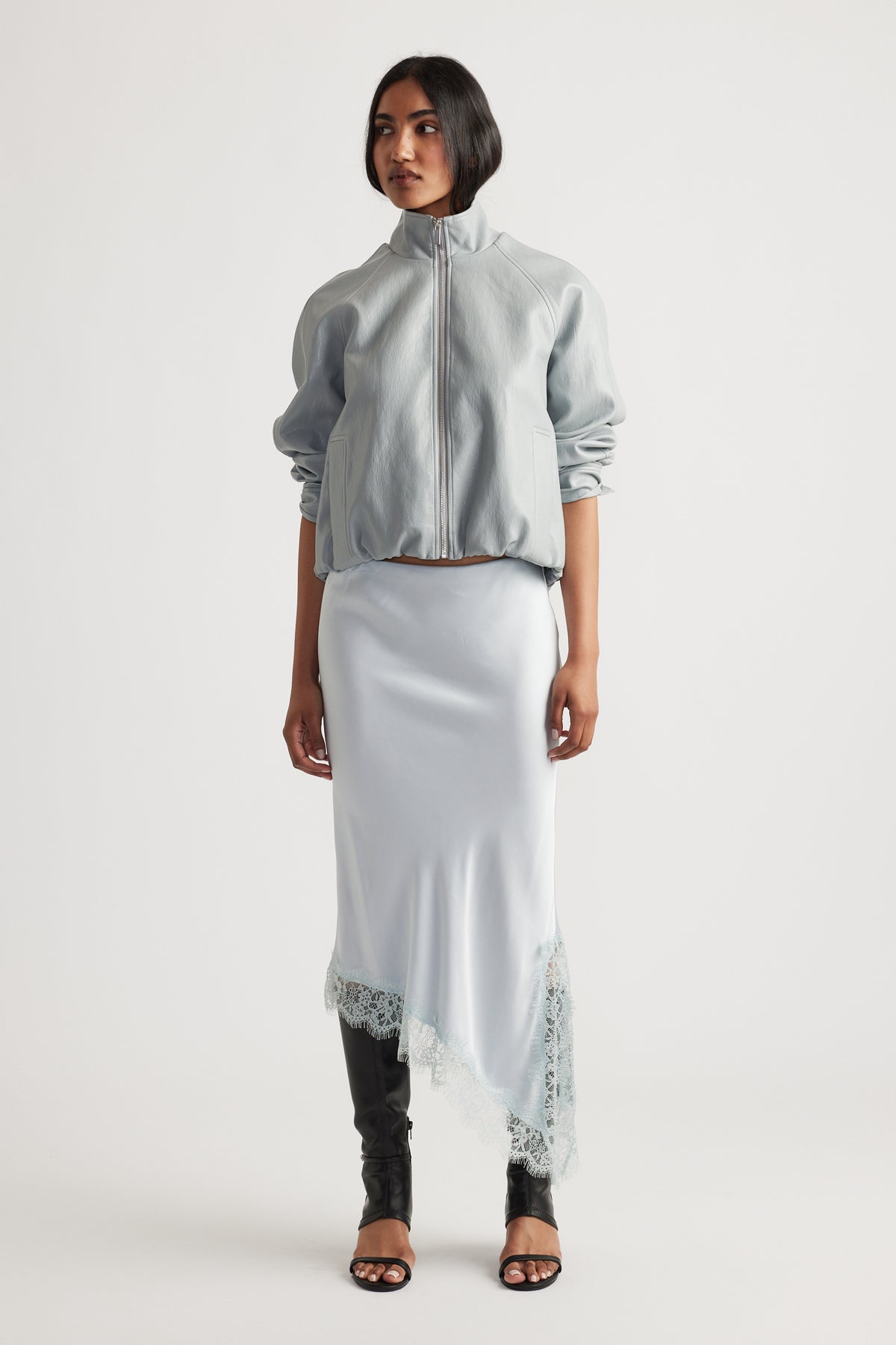 Woman wearing Karla Lace Slip Skirt in 100% viscose with nylon lace trim, styled by DECJUBA Australian fashion brand