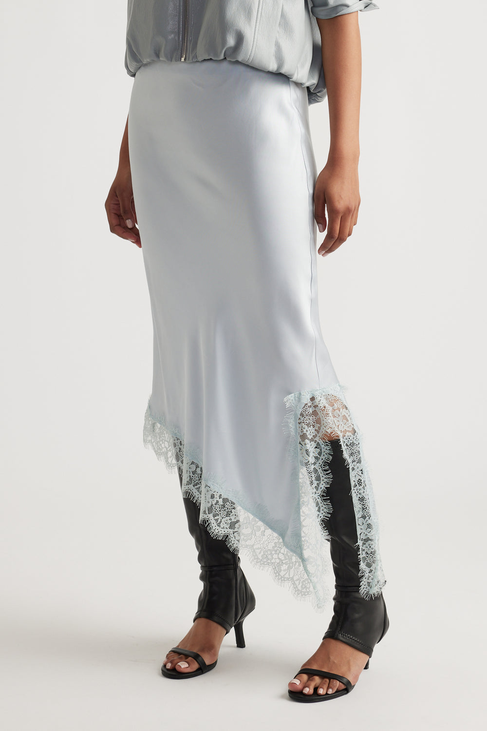 Woman wearing Karla Lace Slip Skirt in light viscose with nylon lace trim, styled by DECJUBA Australian fashion brand