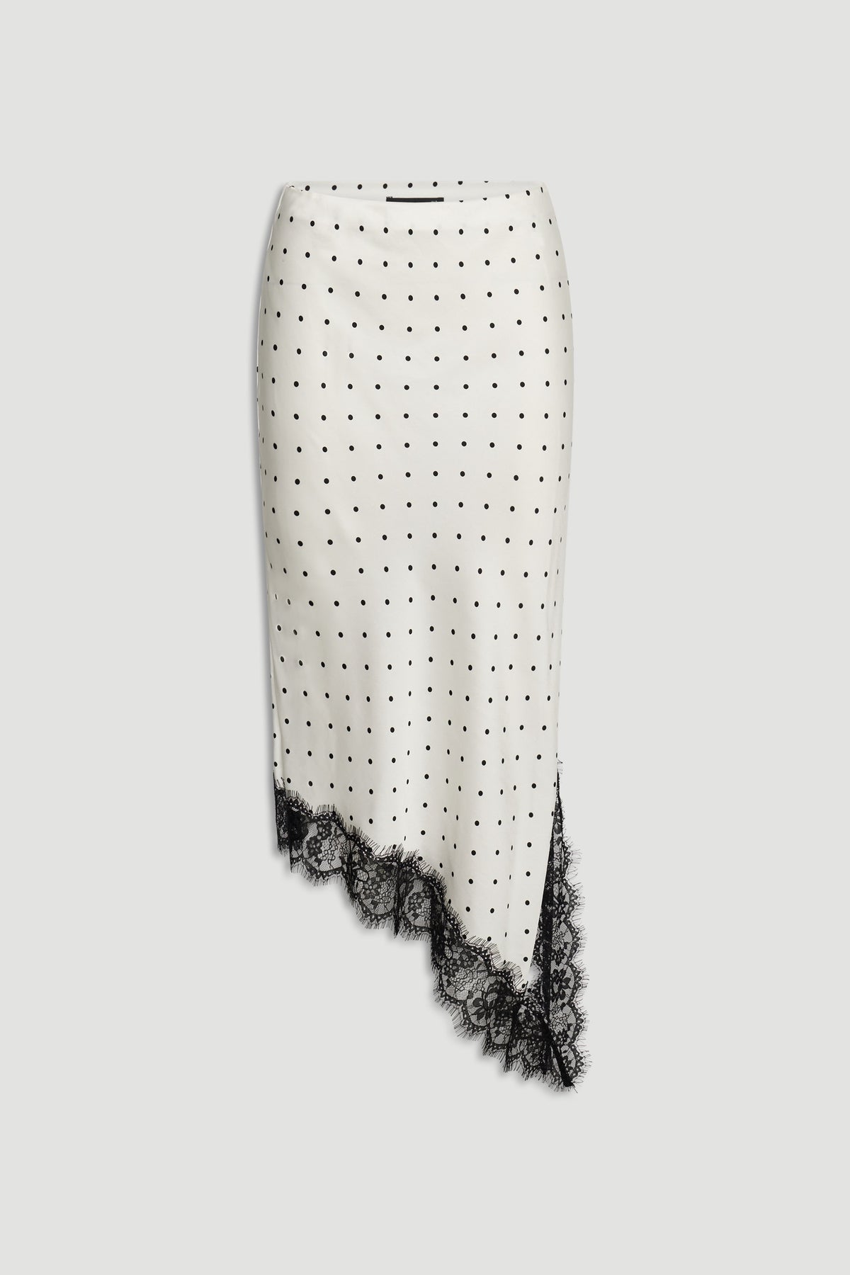 Karla Lace Slip Skirt in ivory with black polka dots, asymmetrical hem, and delicate black lace trim by DECJUBA
