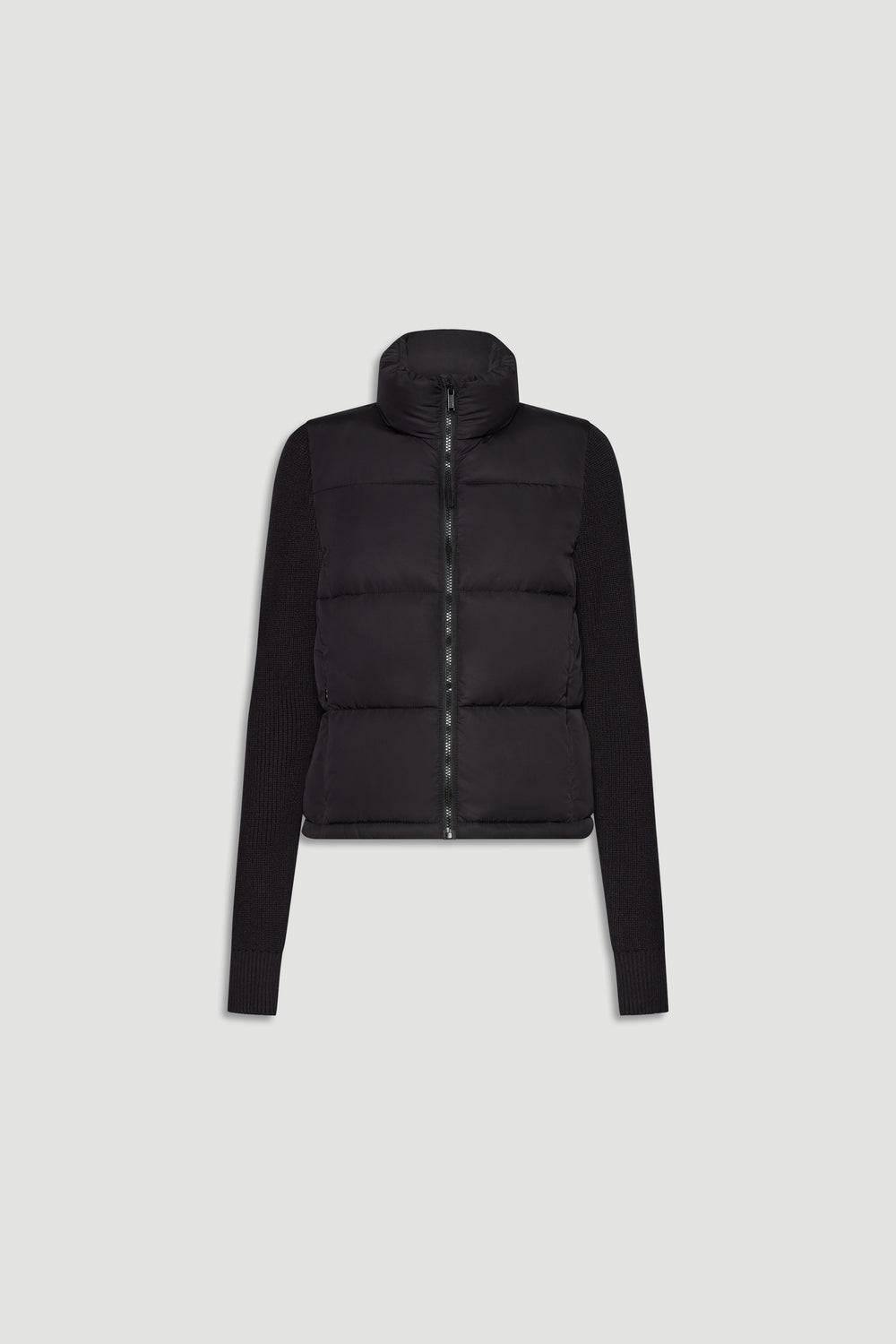 Black knit puffer jacket with padded front and ribbed long sleeves, featuring a high collar and front zip closure.